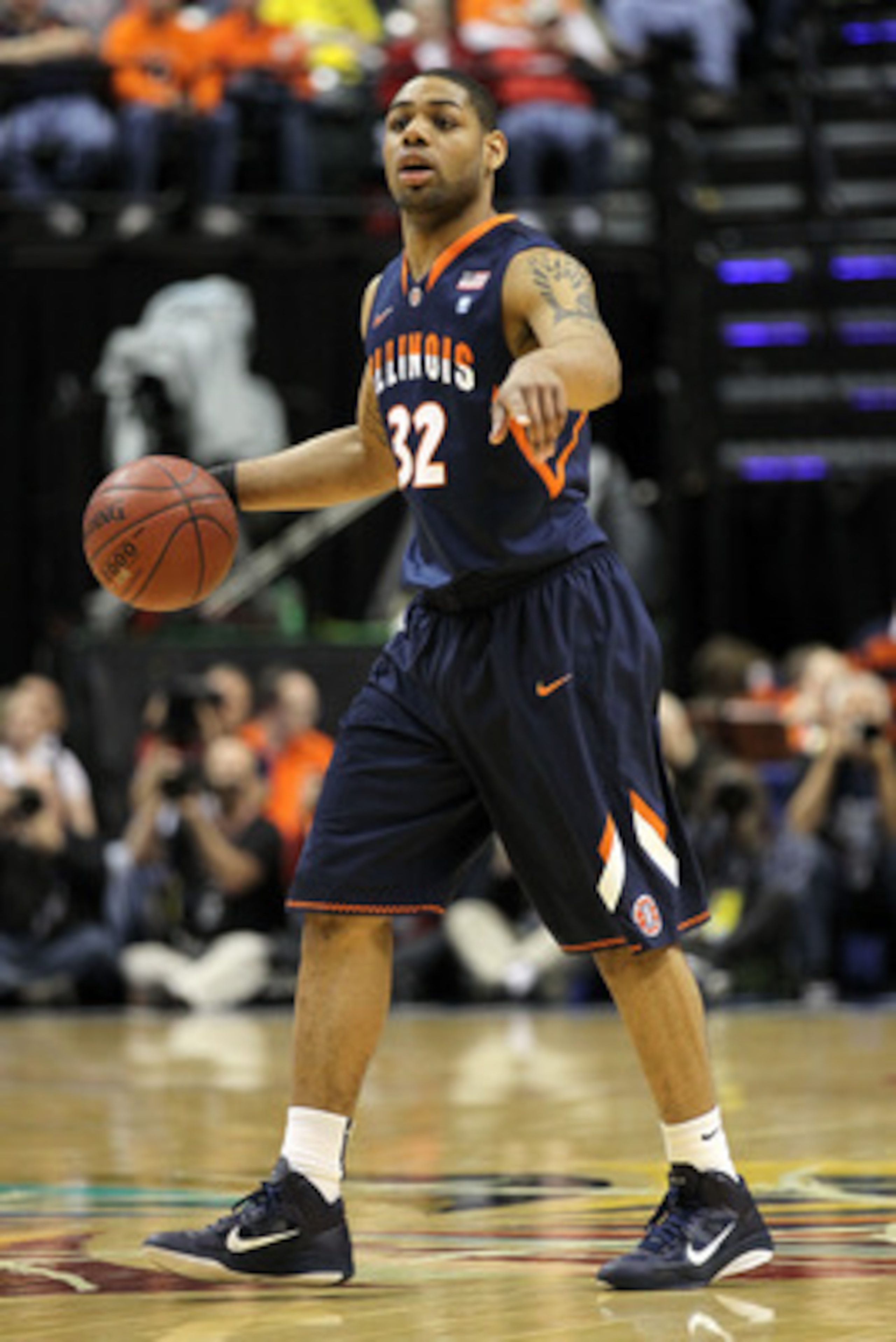 INDIANAPOLIS, IN - MARCH 11:  Demetri McCamey #32 of the Illinois Fighting Illini looks to pass the ball against the Michigan Wolverines during the quarterfinals of the 2011 Big Ten Men's Basketball Tournament at Conseco Fieldhouse on March 11, 2011 in In