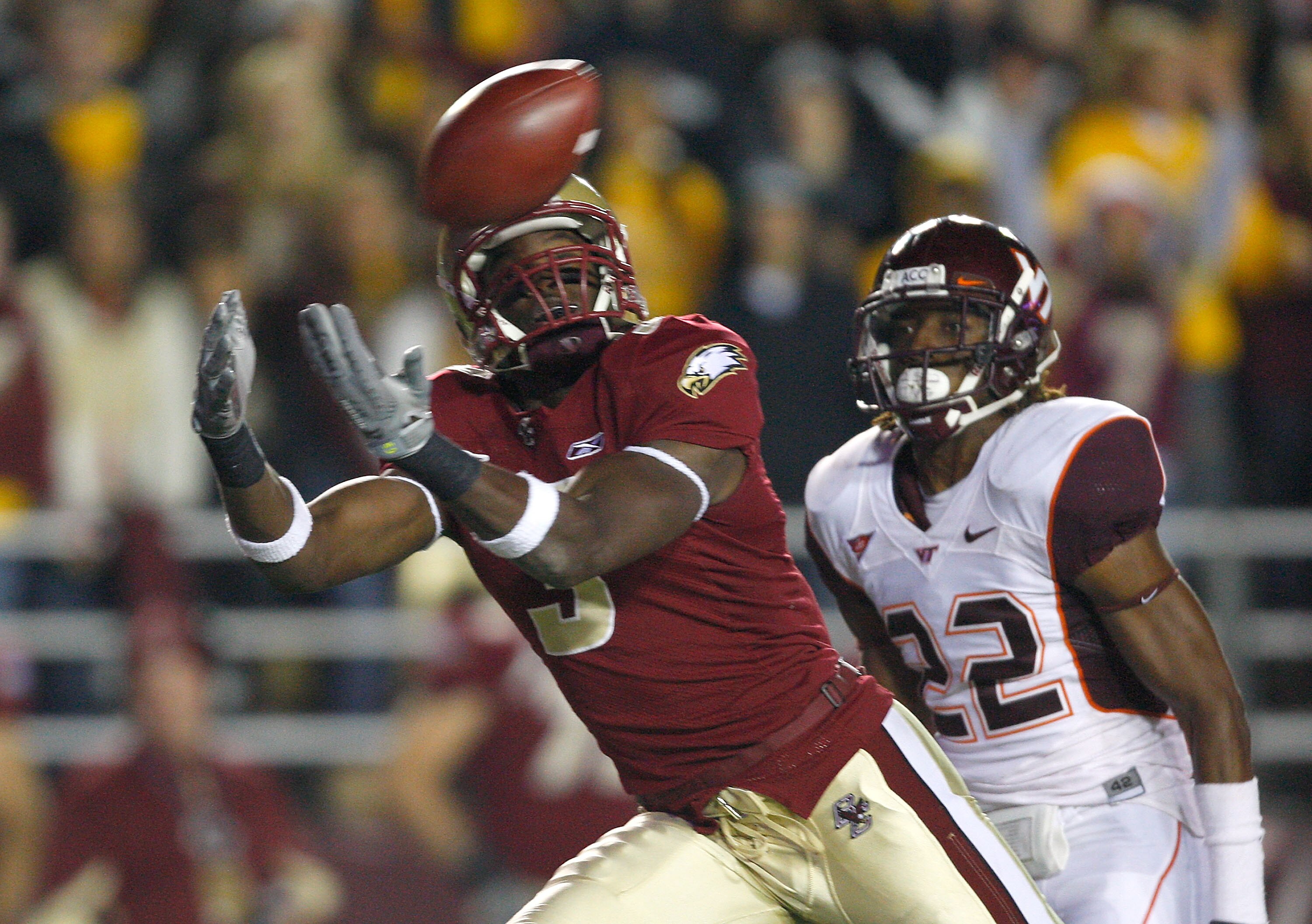CHESTNUT HILL, MA - OCTOBER 18:  Ifeanyi Momah #3 of the Boston College Eagles beats Stephan Virgil #22 of the Virginia Tech Hokies on October 18, 2008 at Alumni Stadium in Chestnut Hill, Massachusetts.  (Photo by Jim Rogash/Getty Images)