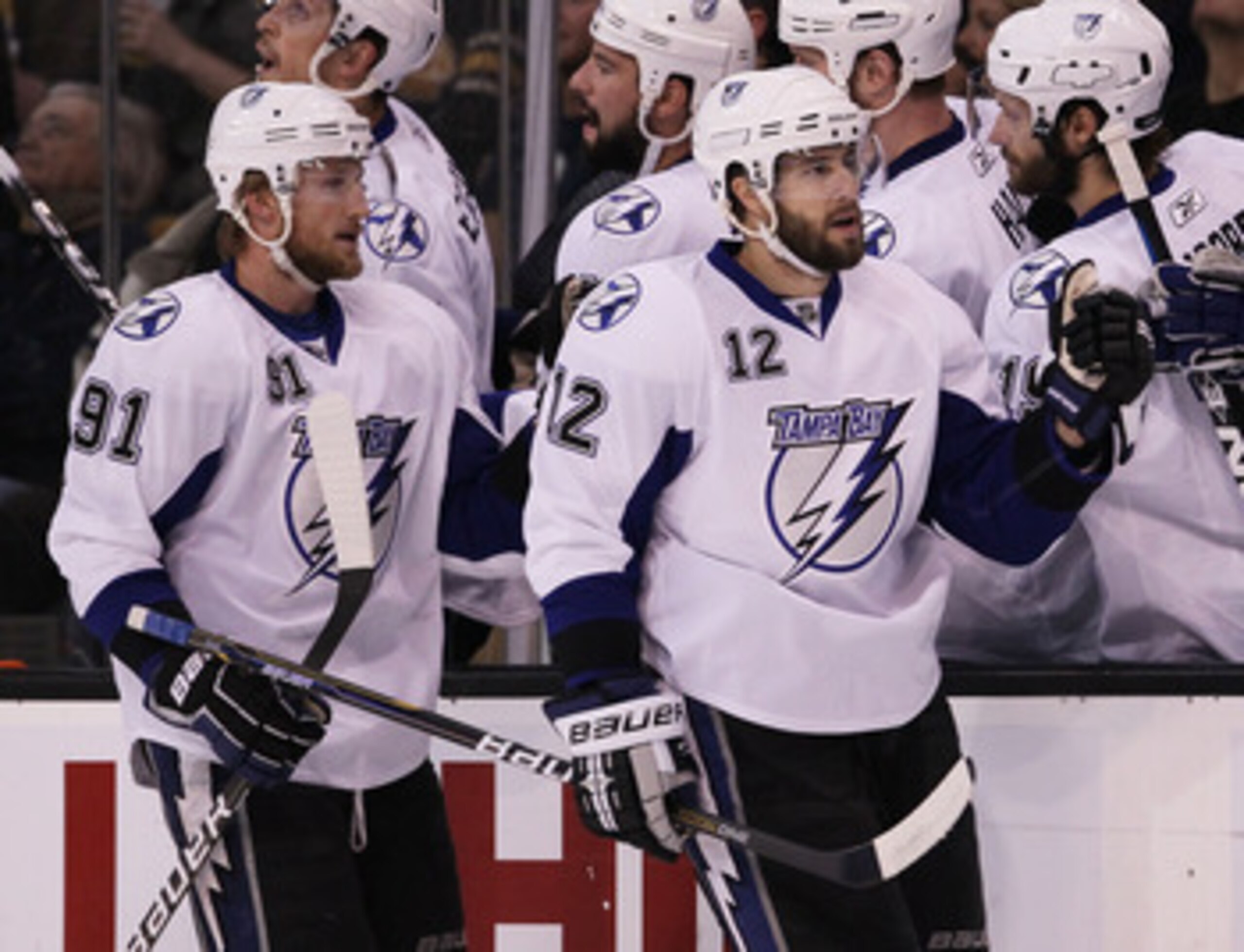 BOSTON, MA - MAY 23:  Simon Gagne #12 and Steven Stamkos #91 of the Tampa Bay Lightning celebrate Gagne's first period goal with teammates in Game Five of the Eastern Conference Finals against the Boston Bruins during the 2011 NHL Stanley Cup Playoffs at
