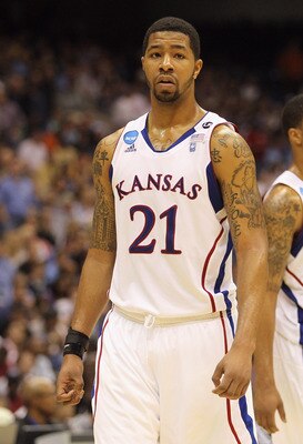 SAN ANTONIO, TX - MARCH 27:  Markieff Morris #21 and Marcus Morris #22 of the Kansas Jayhawks react during the southwest regional final of the 2011 NCAA men's basketball tournament against the Virginia Commonwealth Rams at the Alamodome on March 27, 2011 