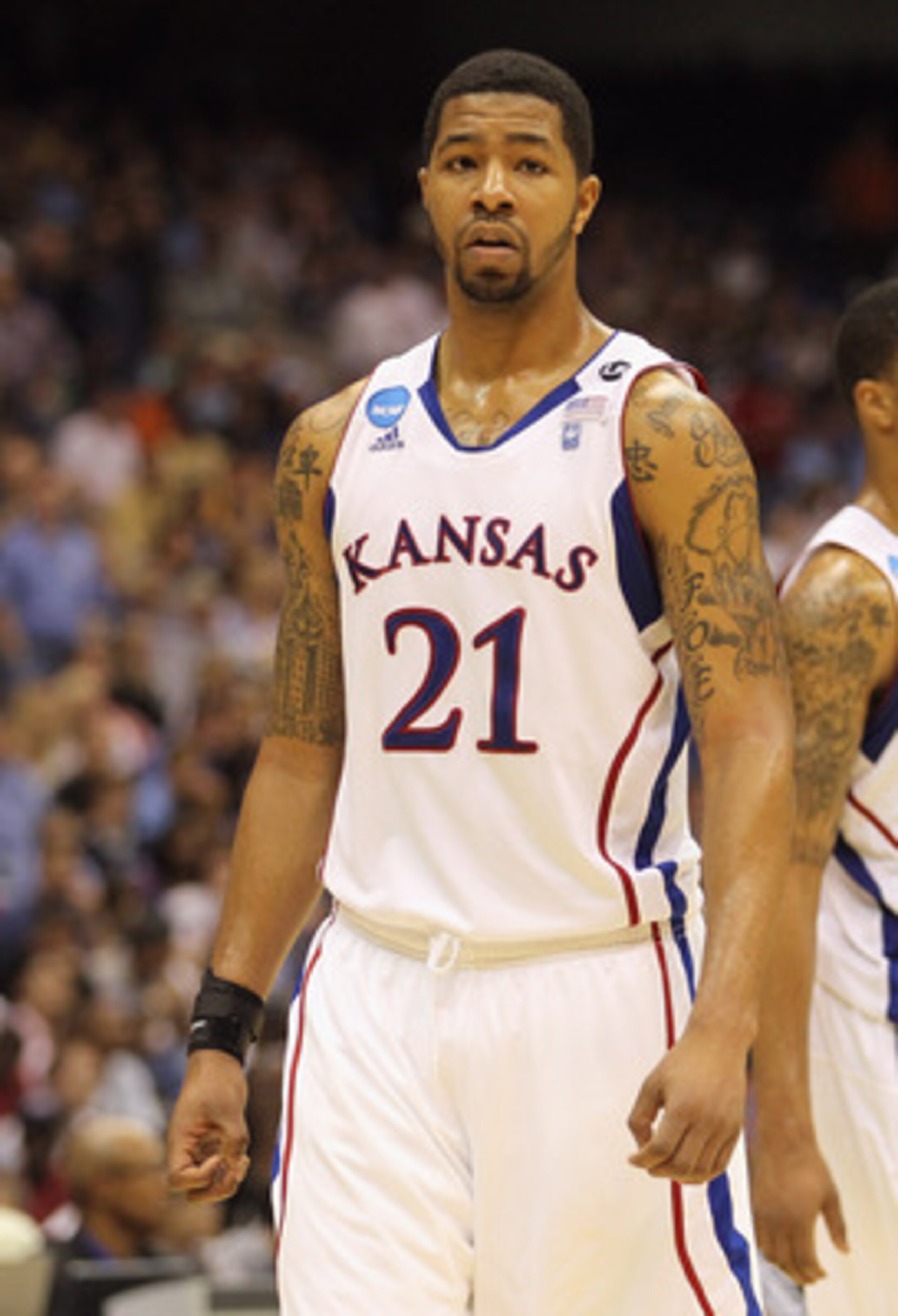 SAN ANTONIO, TX - MARCH 27:  Markieff Morris #21 and Marcus Morris #22 of the Kansas Jayhawks react during the southwest regional final of the 2011 NCAA men's basketball tournament against the Virginia Commonwealth Rams at the Alamodome on March 27, 2011 