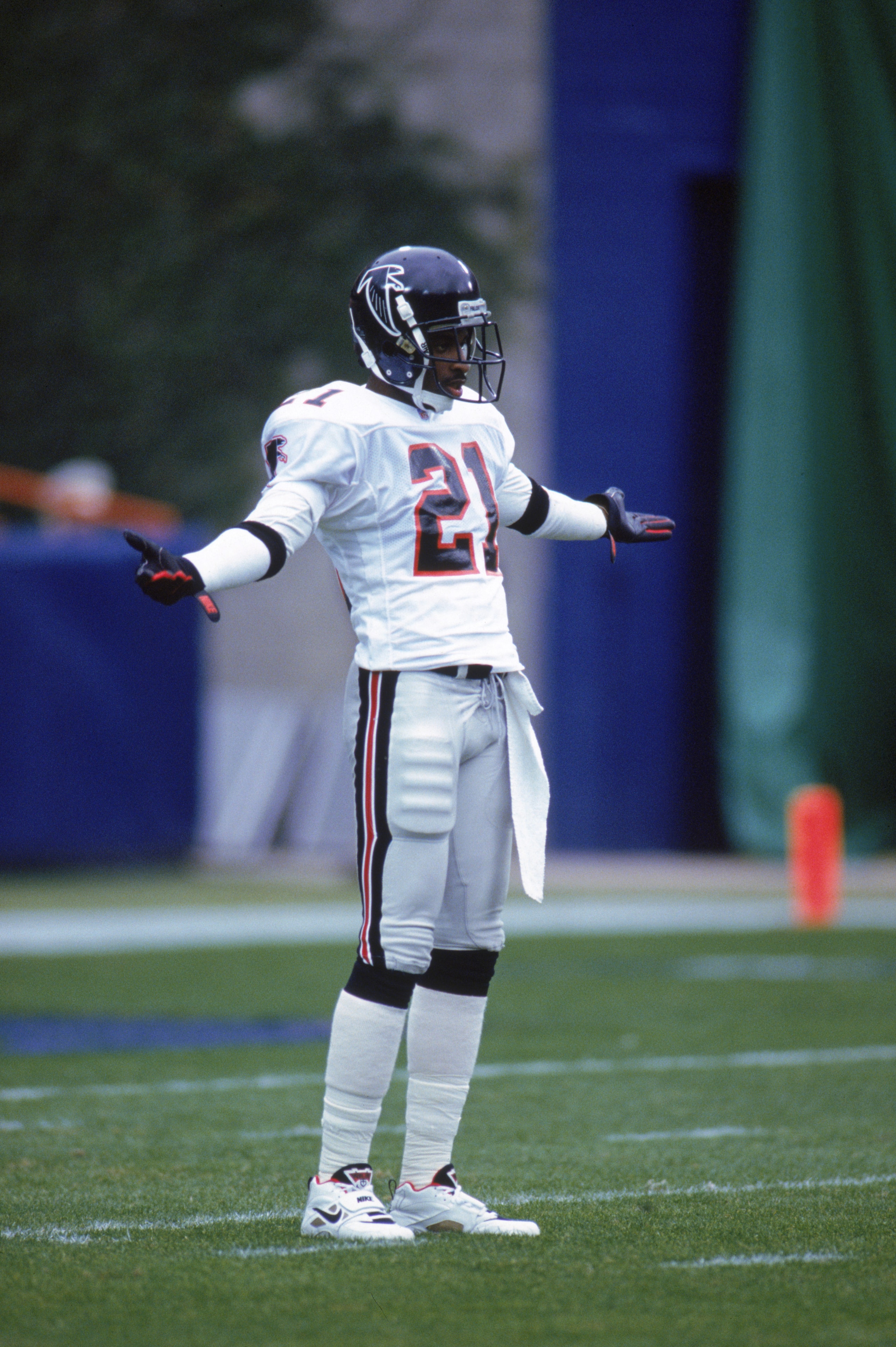 ANAHEIM, CA - DECEMBER 27:  Defensive back Deion Sanders #21 of the Atlanta Falcons strikes a pose as he waits for play during a game against the Los Angeles Rams at Anaheim Stadium on December 27, 1992 in Anaheim, California.  The Rams won 38-27.  (Photo