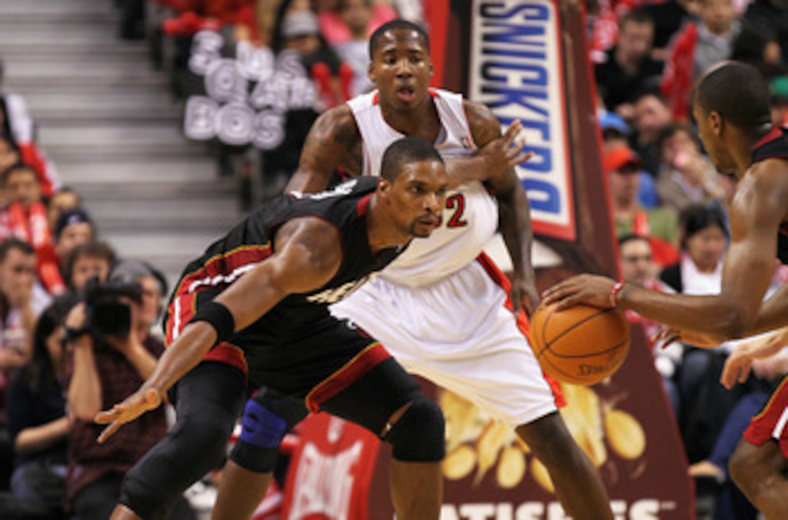 TORONTO, CAN - FEBRUARY 16:  Chris Bosh #1 of the Miami Heat plays a block against Ed Davis #32 of the Toronto Raptors in a game on February 16, 2011 at the Air Canada Centre in Toronto, Canada. The Heat defeated the Raptors 103-95. (Photo by Claus Anders
