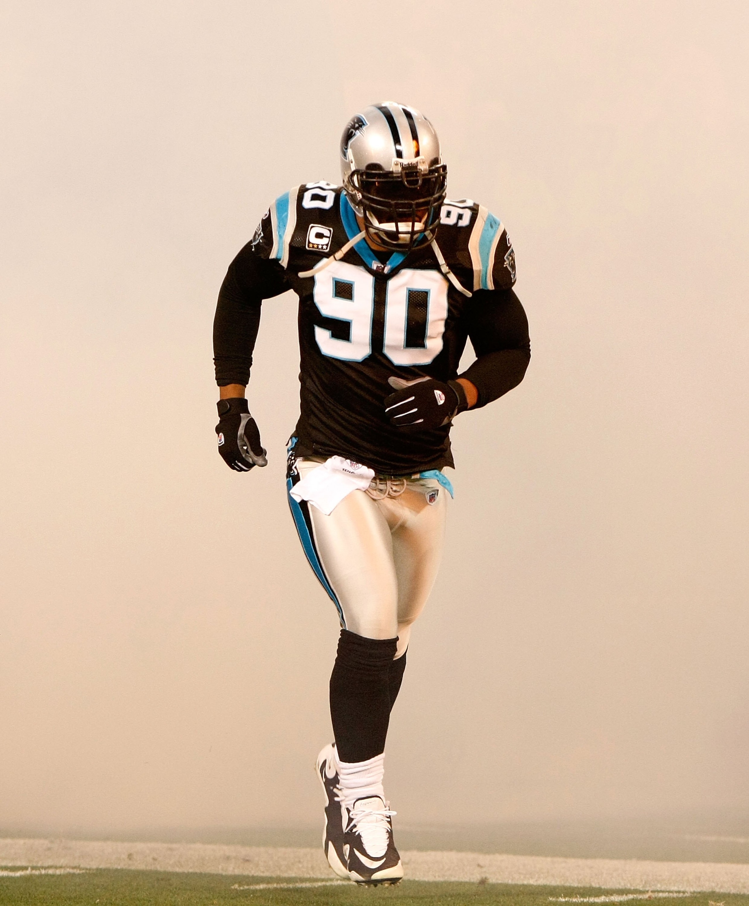 CHARLOTTE, NC - DECEMBER 20:  Julius Peppers #90 of the Carolina Panthers against the Minnesota Vikings at Bank of America Stadium on December 20, 2009 in Charlotte, North Carolina.  (Photo by Kevin C. Cox/Getty Images)