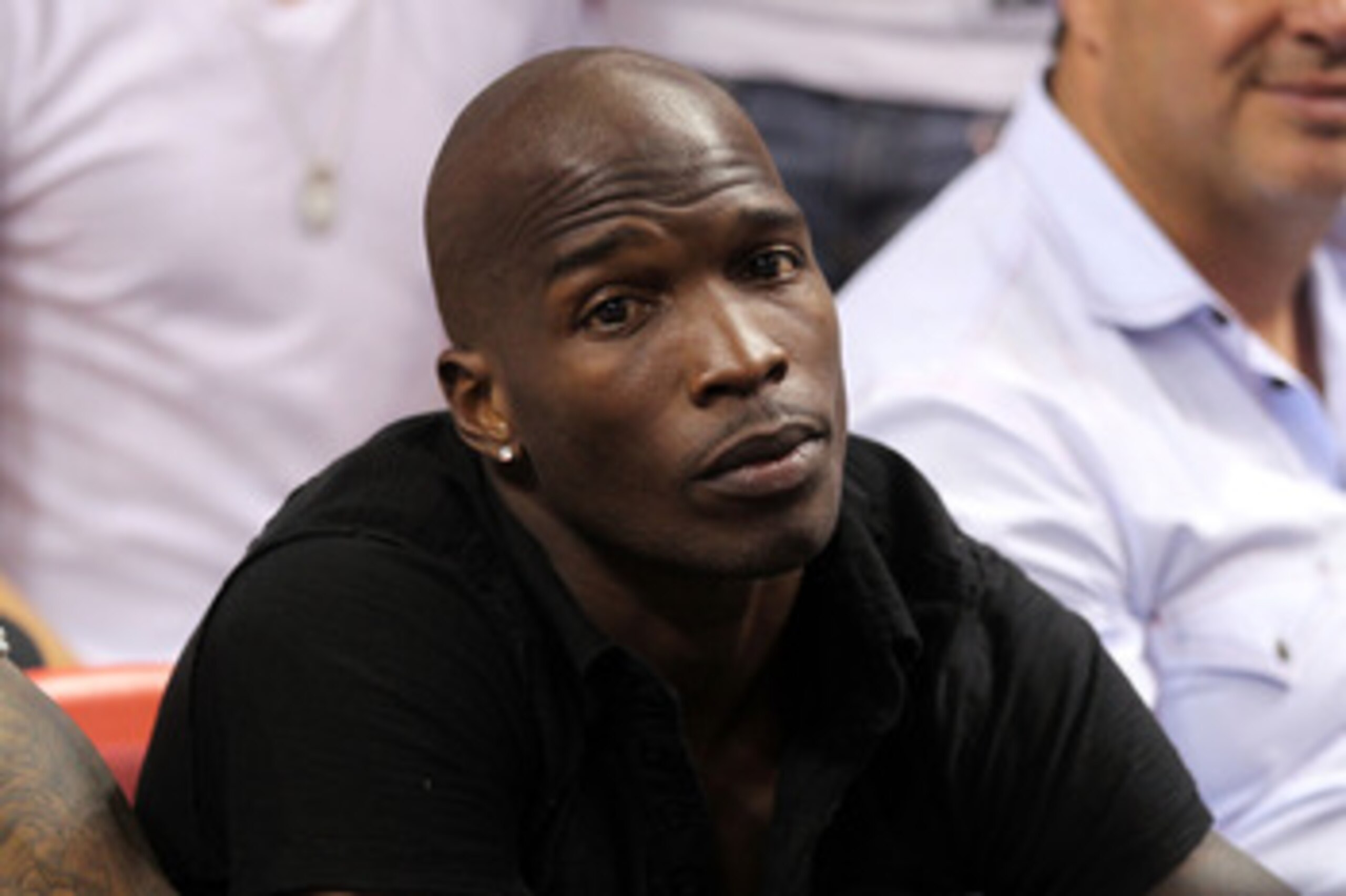 MIAMI, FL - MAY 24:  Chad 'Ochocinco' Johnson watches the Miami Heat play against the Chicago Bulls in Game Four of the Eastern Conference Finals during the 2011 NBA Playoffs on May 24, 2011 at American Airlines Arena in Miami, Florida. NOTE TO USER: User