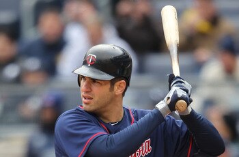 NEW YORK, NY - APRIL 07:  Joe Mauer #7 of the Minnesota Twins against New York Yankees at Yankee Stadium on April 7, 2011 in the Bronx borough of New York City.  (Photo by Nick Laham/Getty Images)