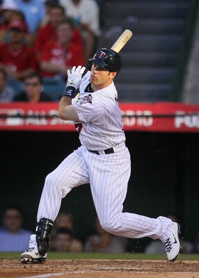 ANAHEIM, CA - JULY 13:  American League All-Star Joe Mauer #7 of the Minnesota Twins swings the bat during the 81st MLB All-Star Game at Angel Stadium of Anaheim on July 13, 2010 in Anaheim, California.  (Photo by Jeff Gross/Getty Images)