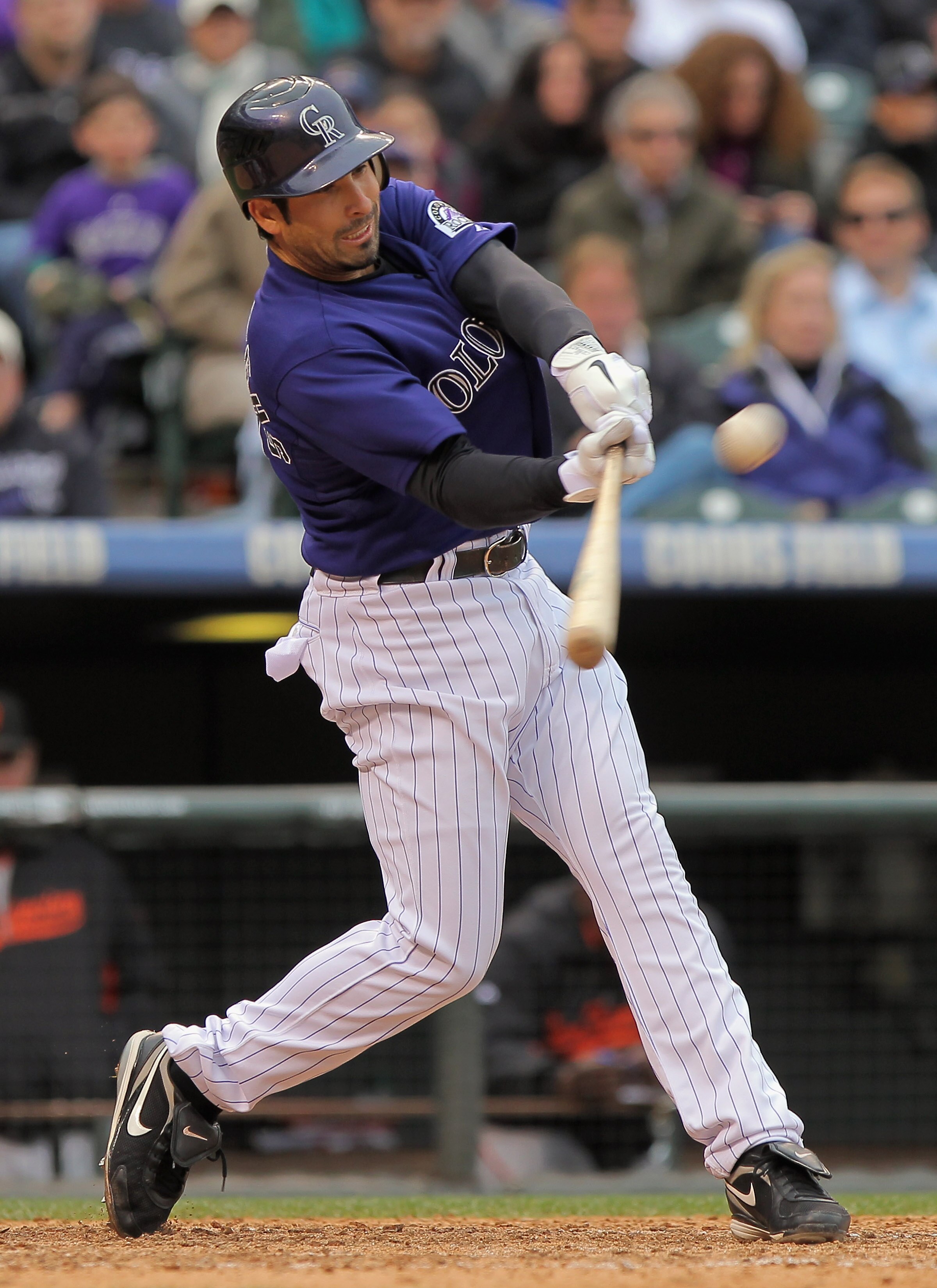 DENVER, CO - APRIL 20:  Ryan Spilborghs #19 of the Colorado Rockies hits a three run homerun off of Guillermo Mota #59 of the San Francisco Giants in the eighth inning at Coors Field on April 20, 2011 in Denver, Colorado. The Rockies defeated the Giants 1