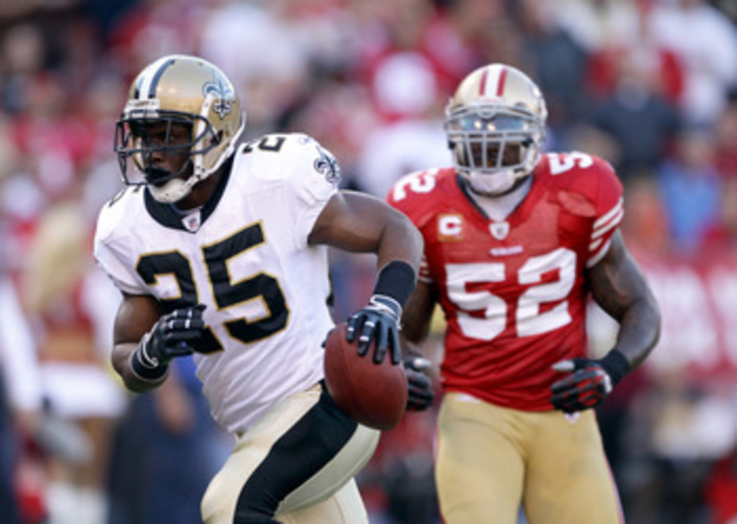 SAN FRANCISCO - SEPTEMBER 20:  Reggie Bush #25 of the New Orleans Saints runs past Patrick Willis #52 of the San Francisco 49ers to score a touchdown at Candlestick Park on September 20, 2010 in San Francisco, California.  (Photo by Ezra Shaw/Getty Images
