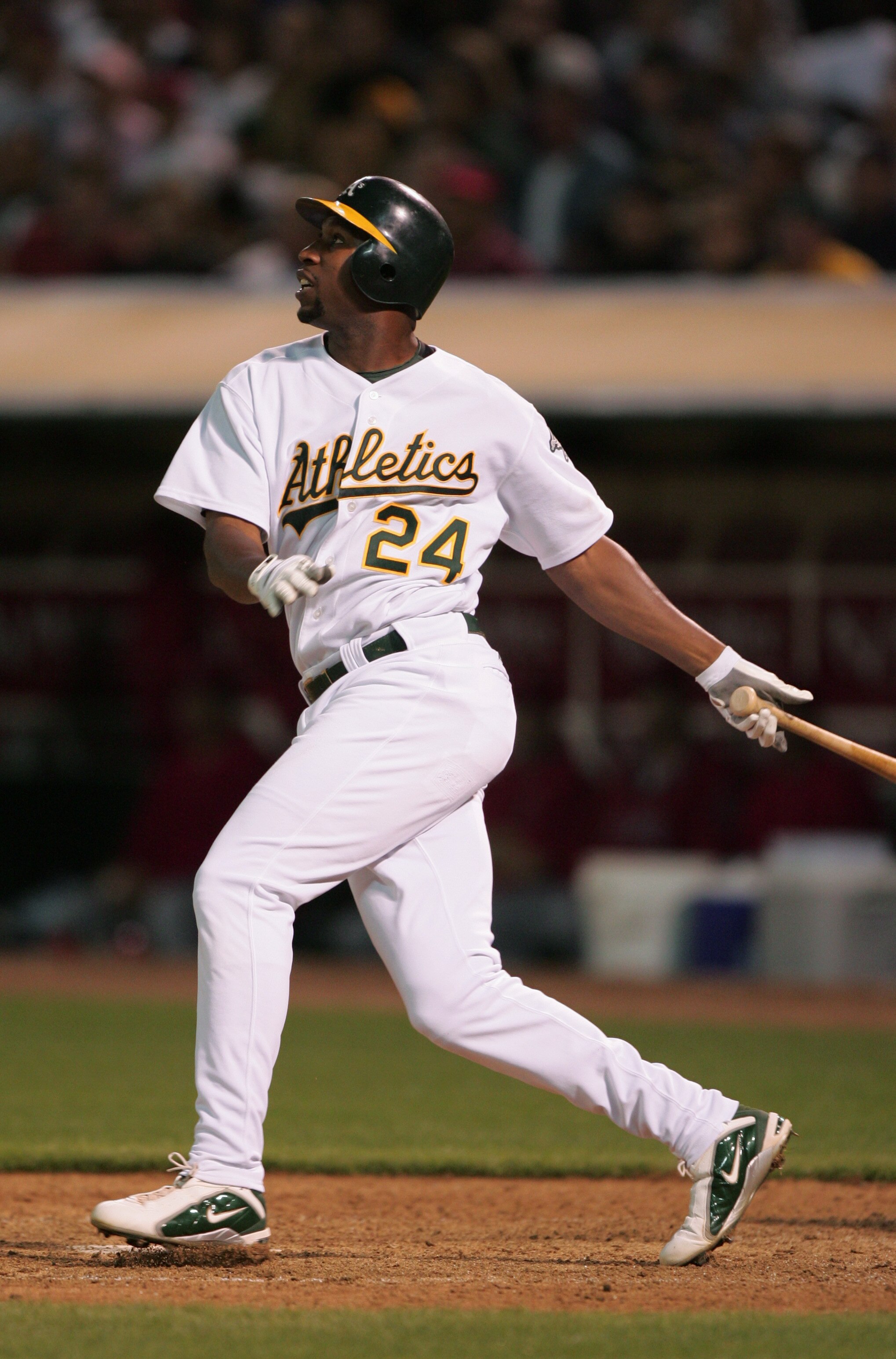 OAKLAND, CA - JUNE 29: Outfielder Jermaine Dye #24 of the Oakland Athletics swings at an Anaheim Angels pitch during the game at the Associates Coliseum on June 29, 2004 in Oakland, California. The Athletics won 5-4. (Photo by Jed Jacobsohn/Getty Images OAKLAND, CA - JUNE 29: Outfielder Jermaine Dye #24 of the Oakland Athletics swings at an Anaheim Angels pitch during the game at the Associates Coliseum on June 29, 2004 in Oakland, California. The Athletics won 5-4. (Photo by Jed Jacobsohn/Getty Images