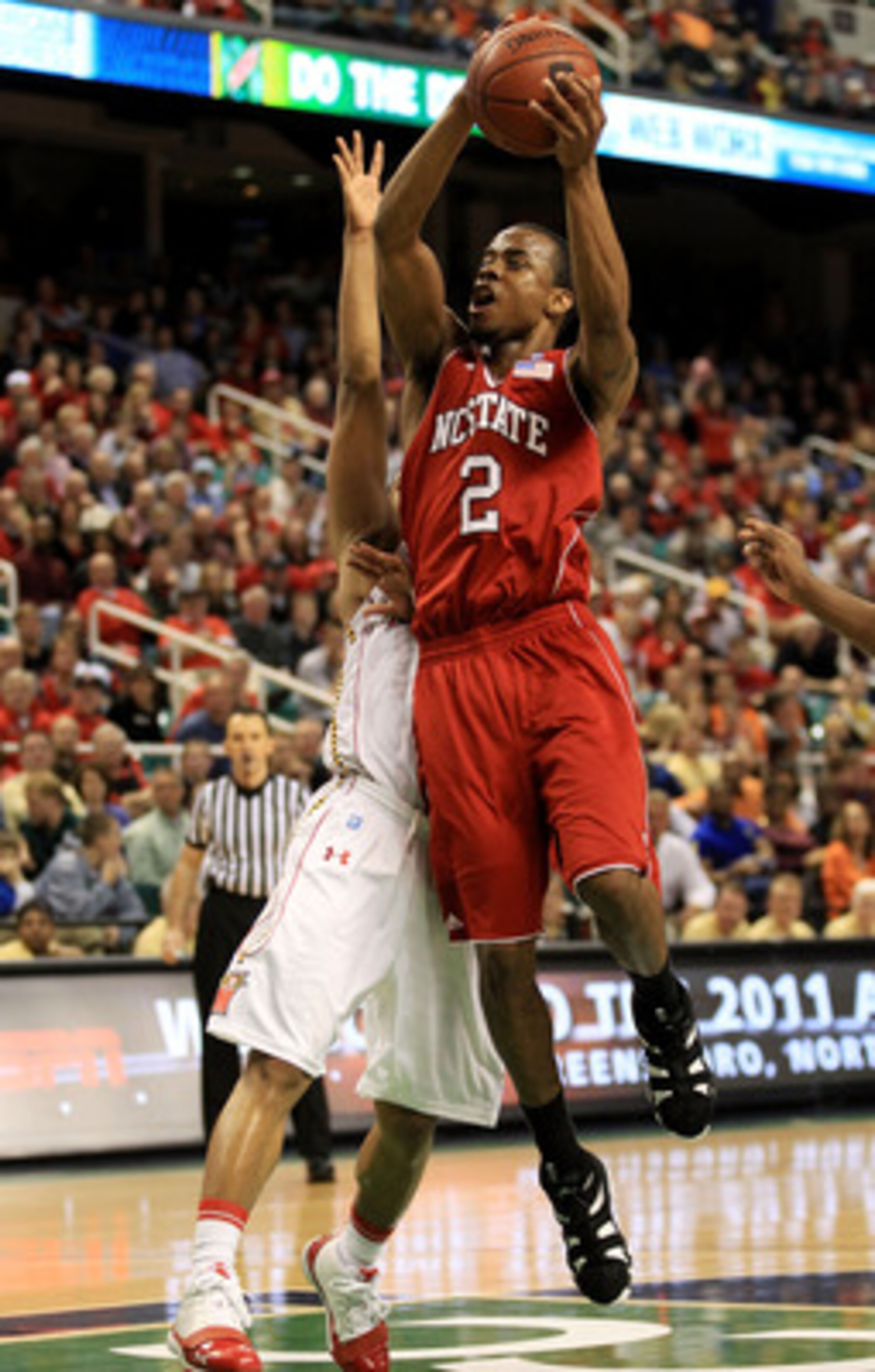 GREENSBORO, NC - MARCH 10:  Lorenzo Brown #2 of the North Carolina State Wolfpack shoots against the Maryland Terrapins during the second half of the game in the first round of the 2011 ACC men's basketball tournament at the Greensboro Coliseum on March 1