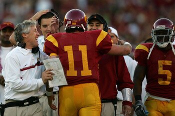 LOS ANGELES, CA - DECEMBER 03:  Matt Leinart #11 of the USC Trojans celebrates with USC head coach Pete Carroll and other assistant coaches after USC scored a touchdown to take a 52-6 lead in the third quarter against the UCLA Bruins December 3, 2005 at t