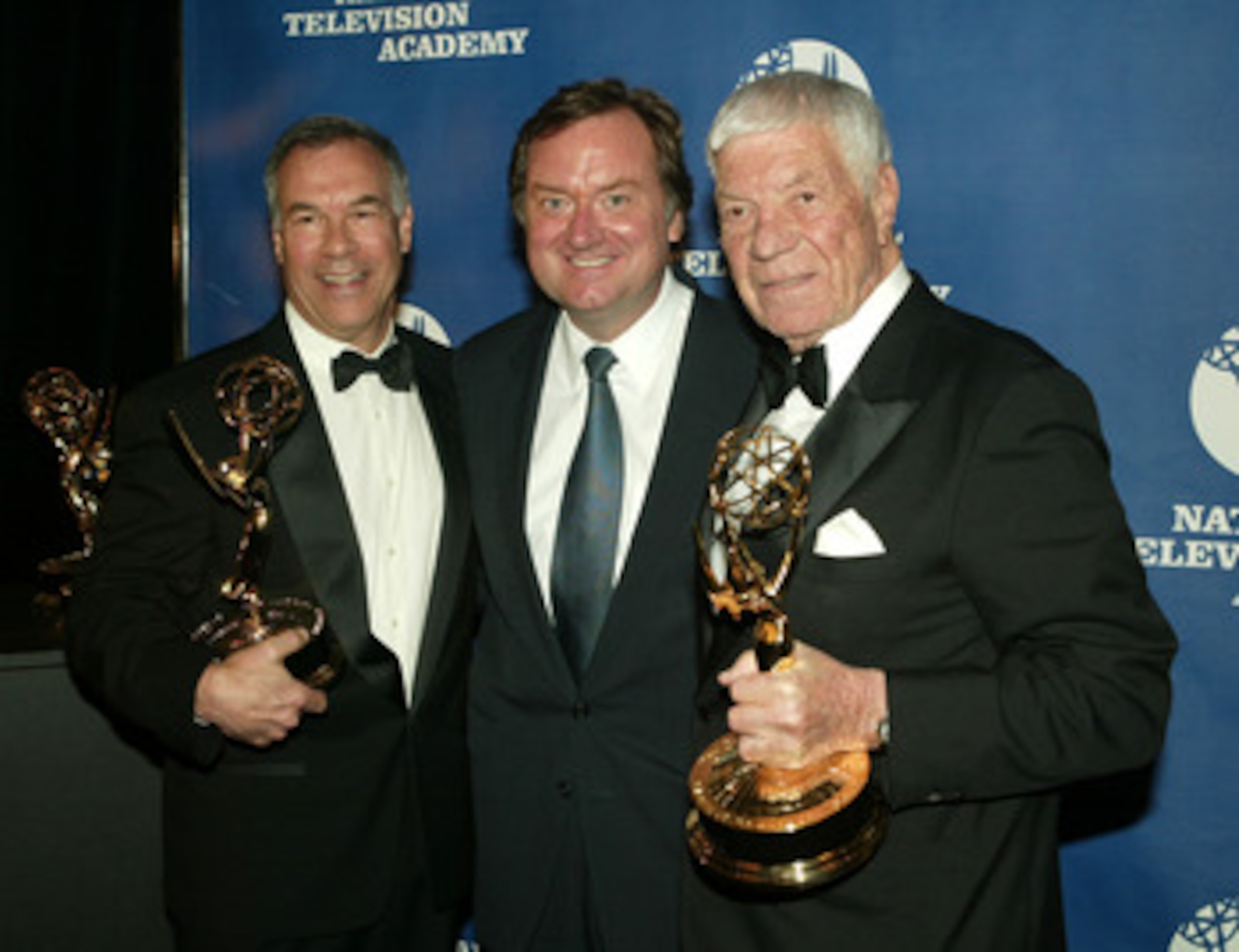NEW YORK - APRIL 19:  (L-R) NFL filmmaker Steve Sabol, 'Meet The Press' host Tim Russert and NFL filmmaker Ed Sabol attend the 25th Annual Sports Emmy Awards April 19, 2004 in New York City.  (Photo by Peter Kramer/Getty Images)