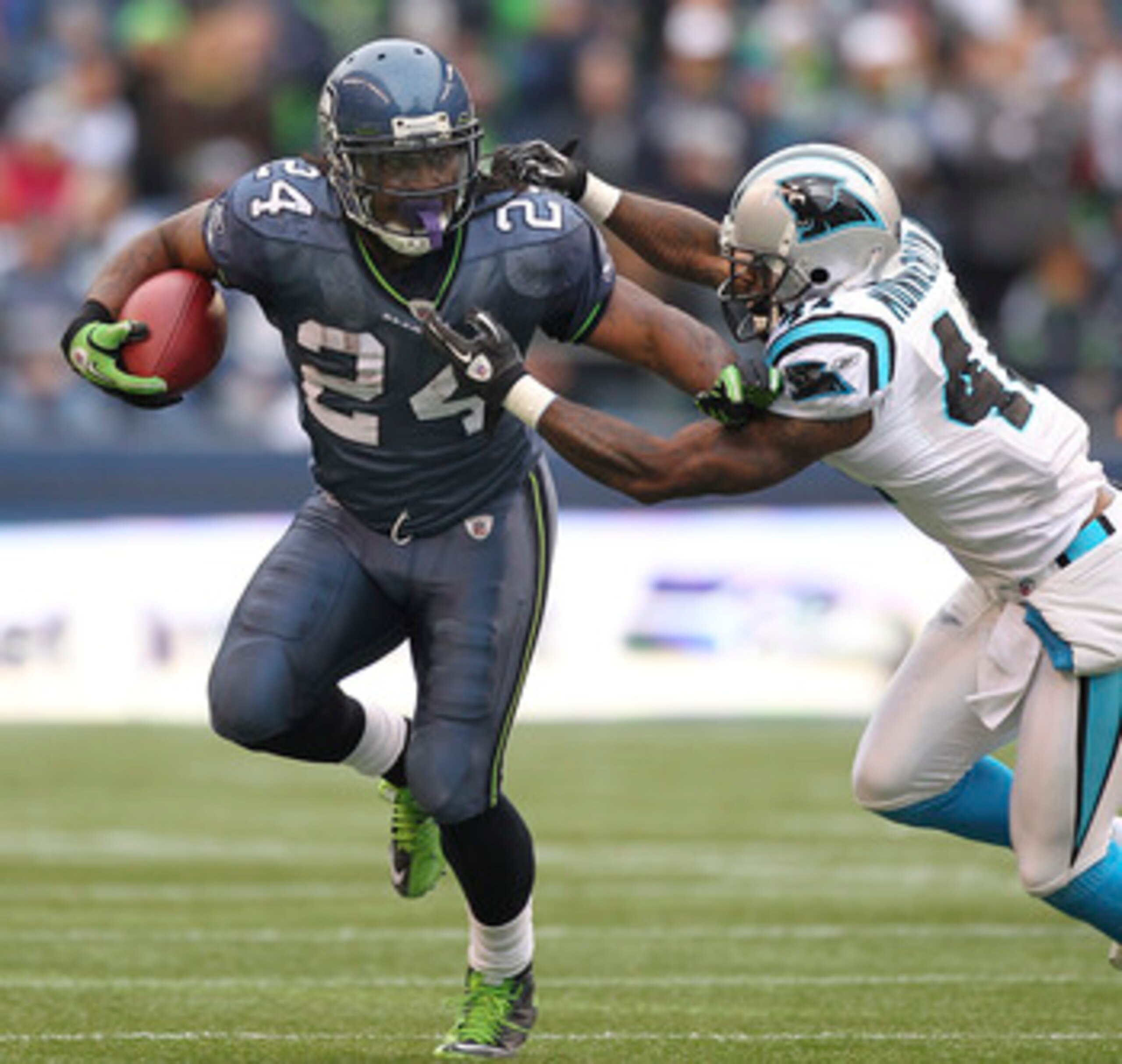SEATTLE, WA - DECEMBER 05:  Running back Marshawn Lynch #24 of the Seattle Seahawks rushes against Captain Munnerlyn #41 of the Carolina Panthers at Qwest Field on December 5, 2010 in Seattle, Washington. The Seahawks defeated the Panthers 31-14. (Photo b