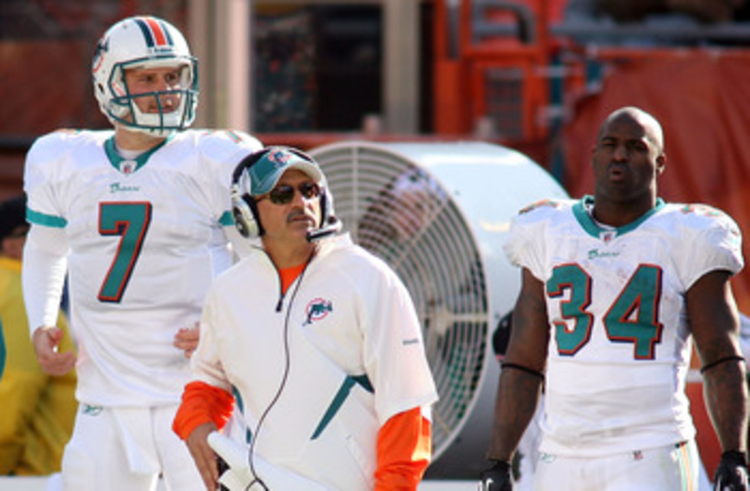 MIAMI - DECEMBER 26: (L-R) Quarterback Chad Henne #7, coach Tony Sparano and running back Ricky Williams #34 of the Miami Dolphins look on from the sidelines against the Detroit Lions at Sun Life Stadium on December 26, 2010 in Miami, Florida.  (Photo by