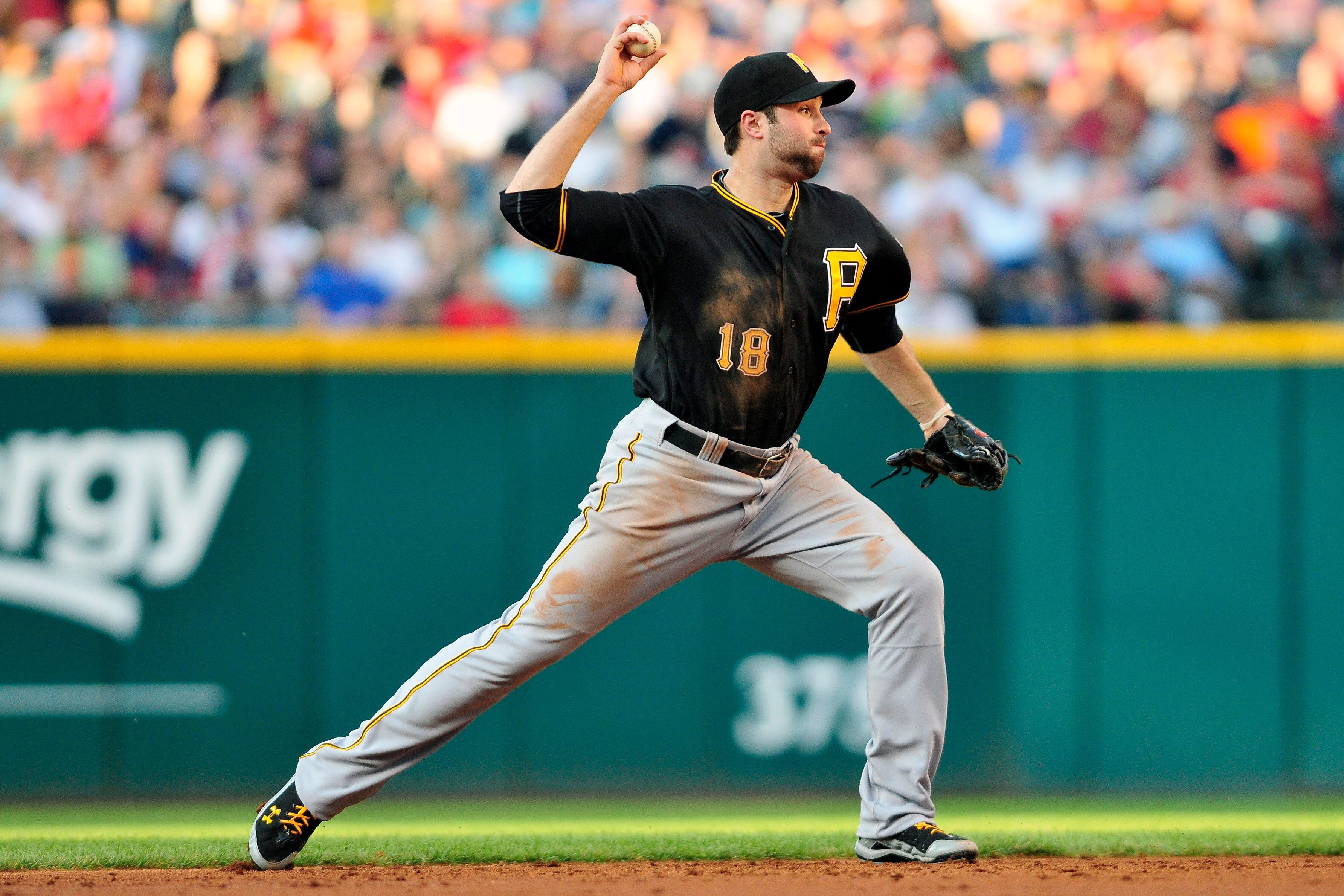 CLEVELAND, OH - JUNE 17:  Neil Walker #18 of the Pittsburgh Pirates makes a wild throw to first during the third inning off a hit from Matt LaPorta #7 (not shown) of the Cleveland Indians at Progressive Field on June 17, 2011 in Cleveland, Ohio. (Photo by