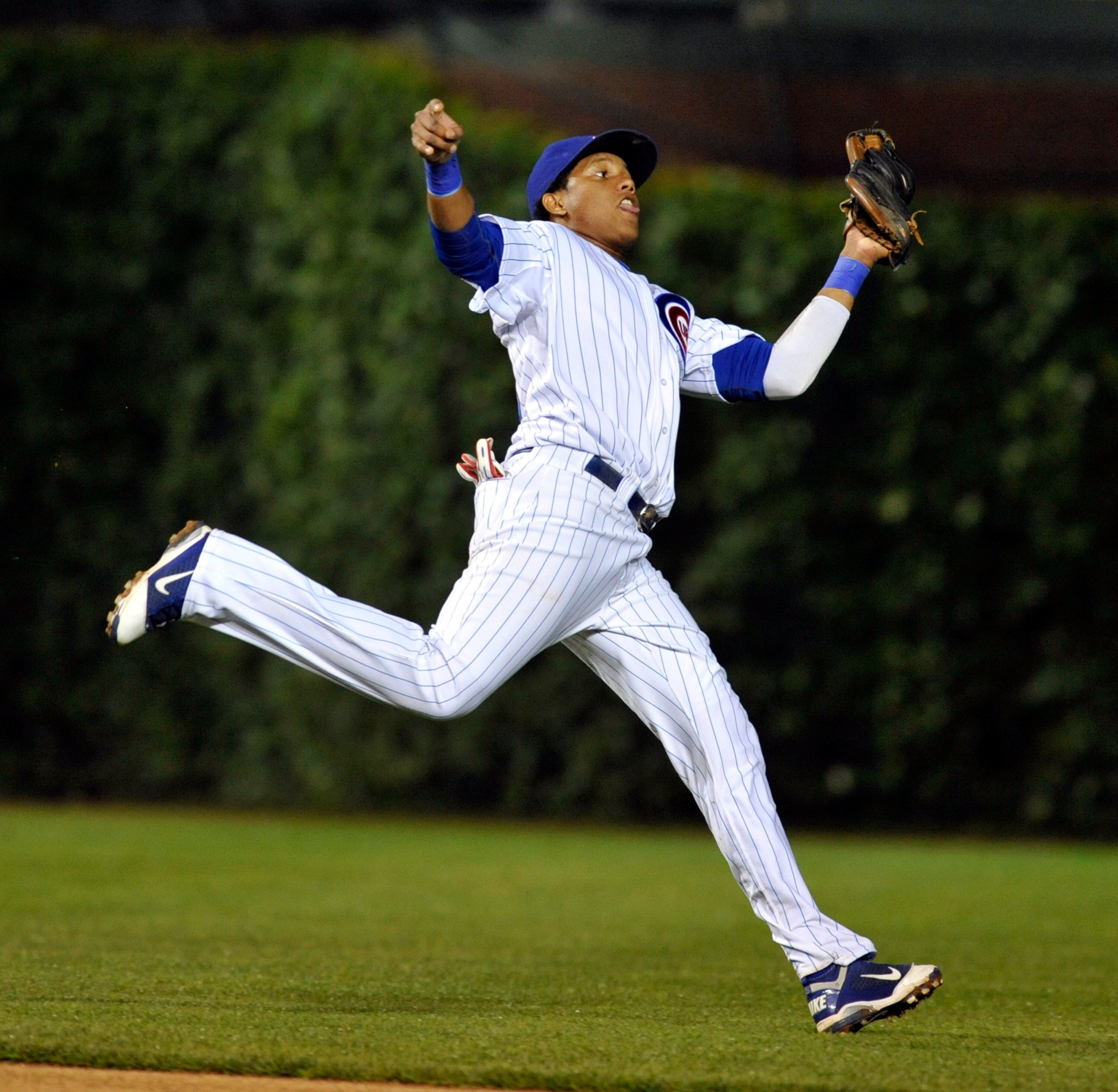 CHICAGO, IL - JUNE 15:  Starlin Castro # 13 of the Chicago Cubs catches a line drive the Milwaukee Brewers on June 15, 2011 at Wrigley Field in Chicago, Illinois.  (Photo by David Banks/Getty Images)