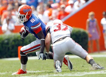 GAINESVILLE, FL - SEPTEMBER 04:  Pat Hinkel #37 of the Miami University RedHawks attempts to tackle Deonte Thompson #6 of the Florida Gators at Ben Hill Griffin Stadium on September 4, 2010 in Gainesville, Florida.  (Photo by Sam Greenwood/Getty Images)