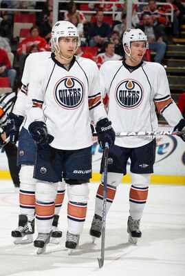 DETROIT - NOVEMBER 11:  Jordan Eberle #14 of the Edmonton Oilers and teammate Taylor Hall #4 prepare for a face-off against the Detroit Red Wings during their NHL game at Joe Louis Arena on November 11, 2010 in Detroit, Michigan.  (Photo by Dave Sandford/