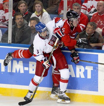 BUFFALO, NY - DECEMBER 28: Martin Frk #5 of the Czech Republic checks Erick Gudbranson #5 of Canada during the 2011 IIHF World U20 Championship game between Canada and the Czech Republic at the HSBC Arena on December 28, 2010 in Buffalo, New York. Canada 