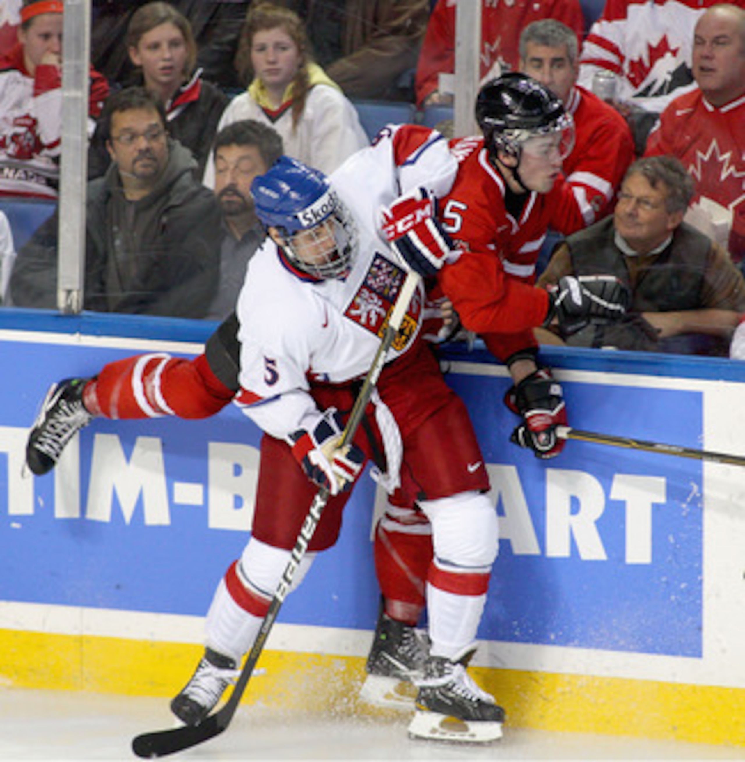 BUFFALO, NY - DECEMBER 28: Martin Frk #5 of the Czech Republic checks Erick Gudbranson #5 of Canada during the 2011 IIHF World U20 Championship game between Canada and the Czech Republic at the HSBC Arena on December 28, 2010 in Buffalo, New York. Canada 