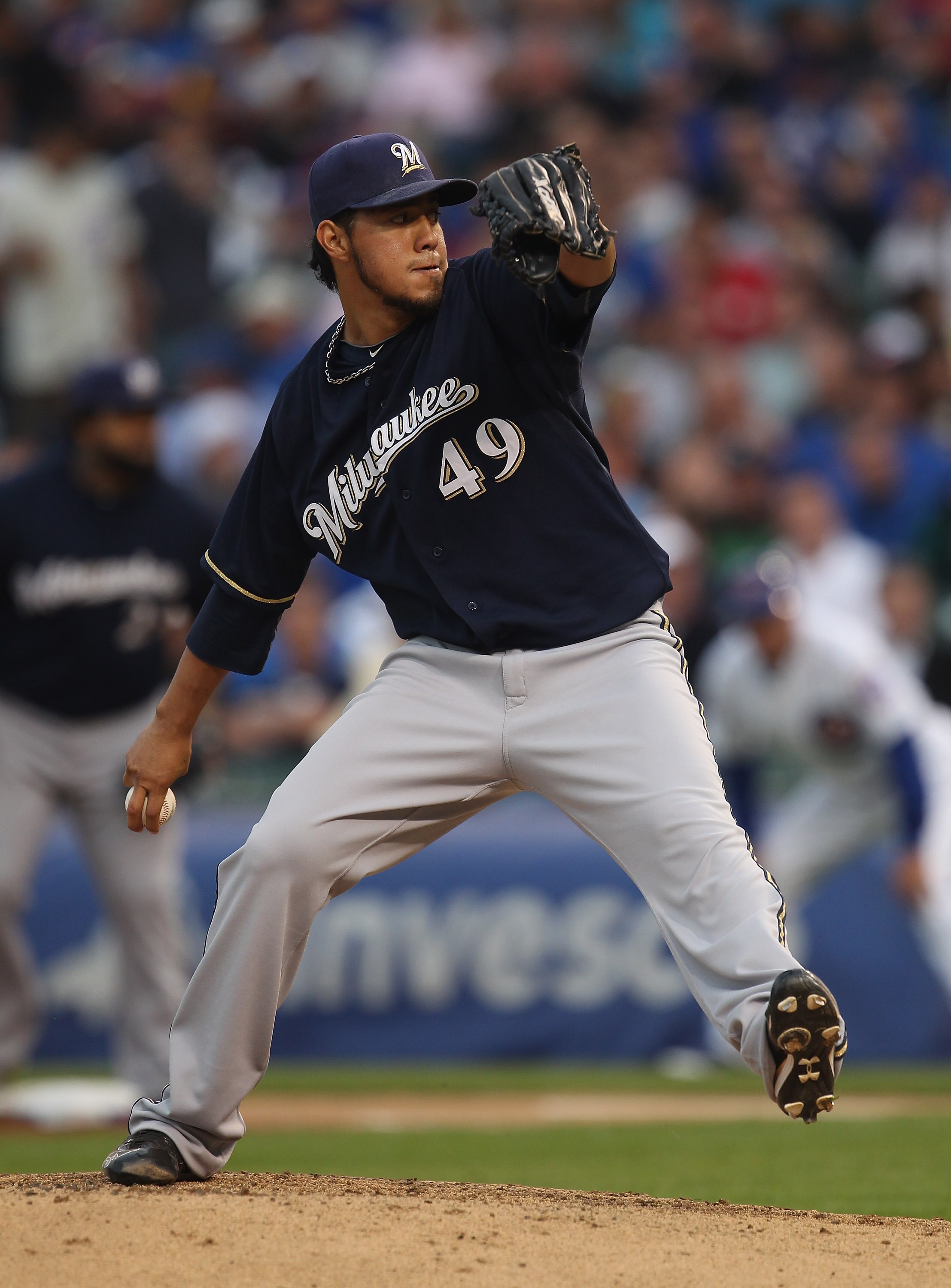 CHICAGO, IL - JUNE 14:  Starting pitcher Yovani Gallardo #49 of the Milwaukee Brewers delivers the ball against the Chicago Cubs at Wrigley Field on June 14, 2011 in Chicago, Illinois.  The Cubs defeated the Brewers 5-4 in 10 innings.  (Photo by Jonathan 