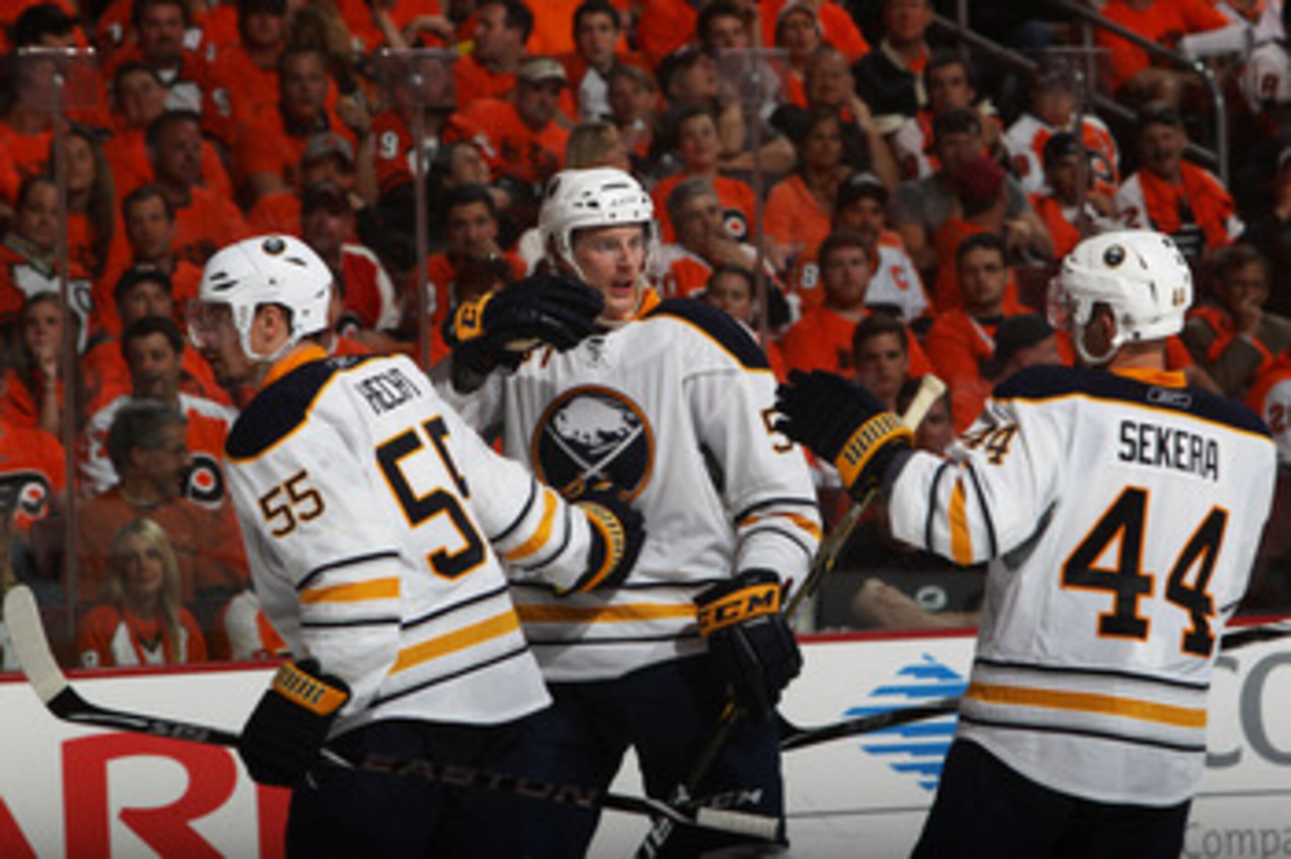 PHILADELPHIA, PA - APRIL 26:  Tyler Myers #57 of the Buffalo Sabres celebrates his third period goal against the Philadelphia Flyers with teammates Jochen Hecht #55 and Andrej Sekera #44 in Game Seven of the Eastern Conference Quarterfinals during the 201