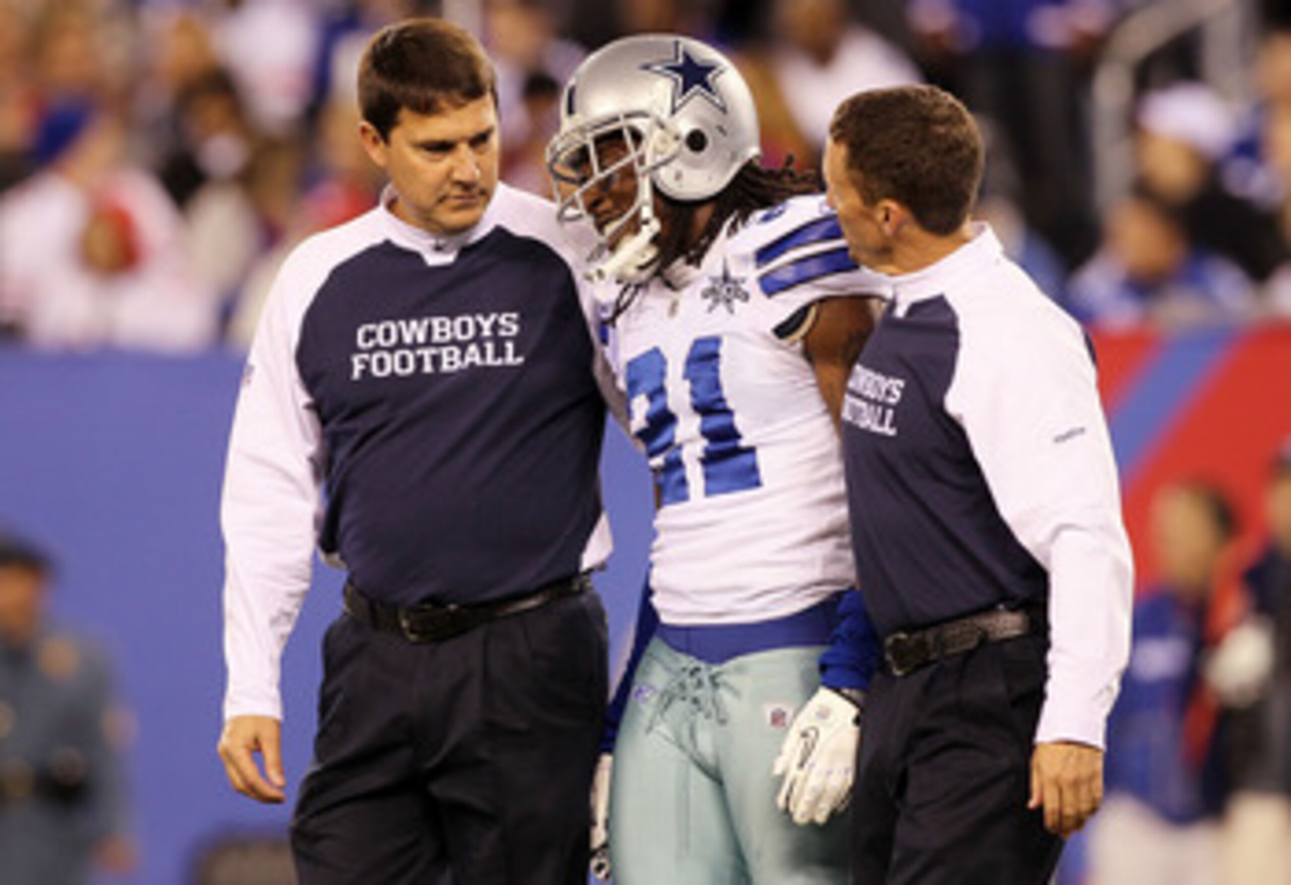 EAST RUTHERFORD, NJ - NOVEMBER 14: Mike Jenkins #21 of the Dallas Cowboys is helped off the field after an injury against the New York Giants on November 14, 2010 at the New Meadowlands Stadium in East Rutherford, New Jersey.  (Photo by Jim McIsaac/Getty