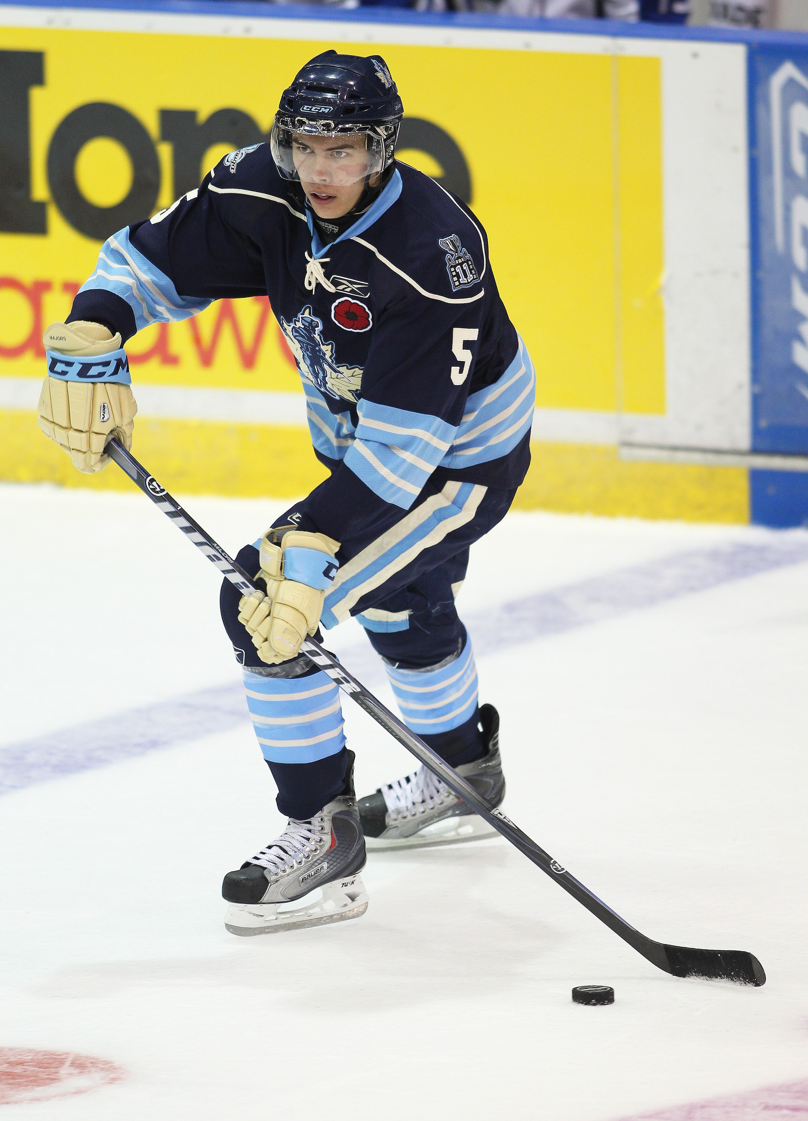 MISSISSAUGA, CANADA - MAY 20:  Stuart Percy #5 of the Mississauga St. Michael's Majors skates with the puck against the Saint John Sea Dogs in the opening game of the 2011 Mastercard Memorial Cup at the Hershey Centre in Mississauga, Canada. The Sea Dogs 