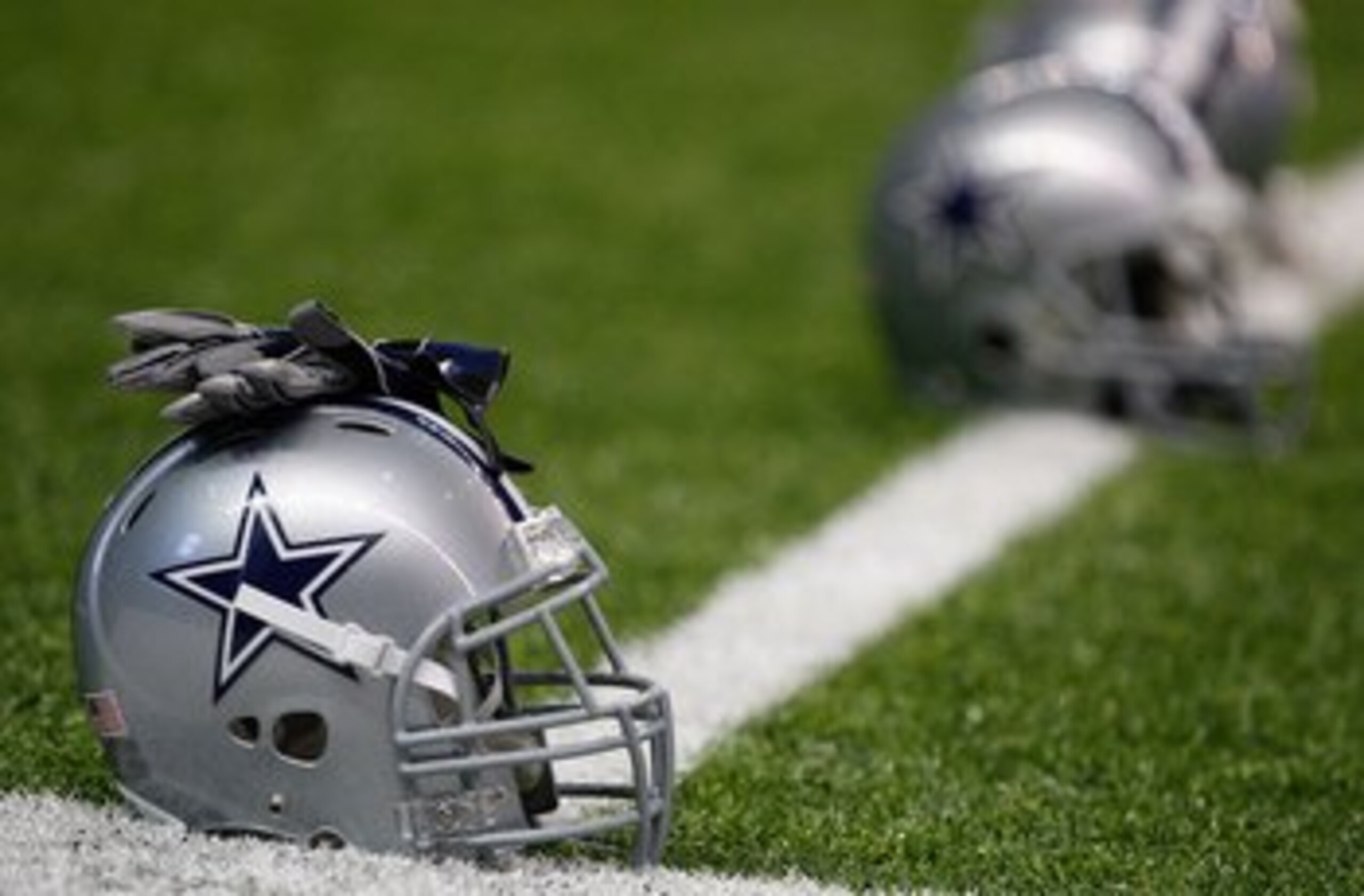 SAN ANTONIO - AUGUST 06:  Helmets of the Dallas Cowboys during training camp at the Alamodome on August 6, 2009 in San Antonio, Texas.  (Photo by Ronald Martinez/Getty Images)