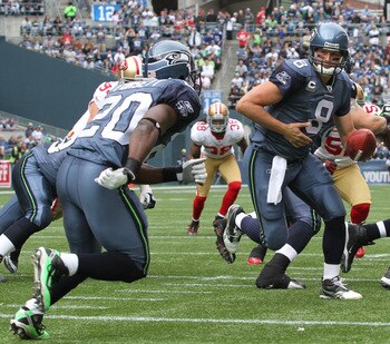 SEATTLE - SEPTEMBER 12:  Quarterback Matt Hasselbeck #8 of the Seattle Seahawks hands off to Justin Forsett #20 during the NFL season opener against the San Francisco 49ers at Qwest Field on September 12, 2010 in Seattle, Washington. (Photo by Otto Greule