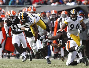 CLEVELAND, OH - JANUARY 02:  Safety Ryan Clark #25 of the Pittsburgh Steelers returns an interception as he is hit by tight end Benjamin Watson #82 of the Cleveland Browns at Cleveland Browns Stadium on January 2, 2011 in Cleveland, Ohio.  (Photo by Matt 