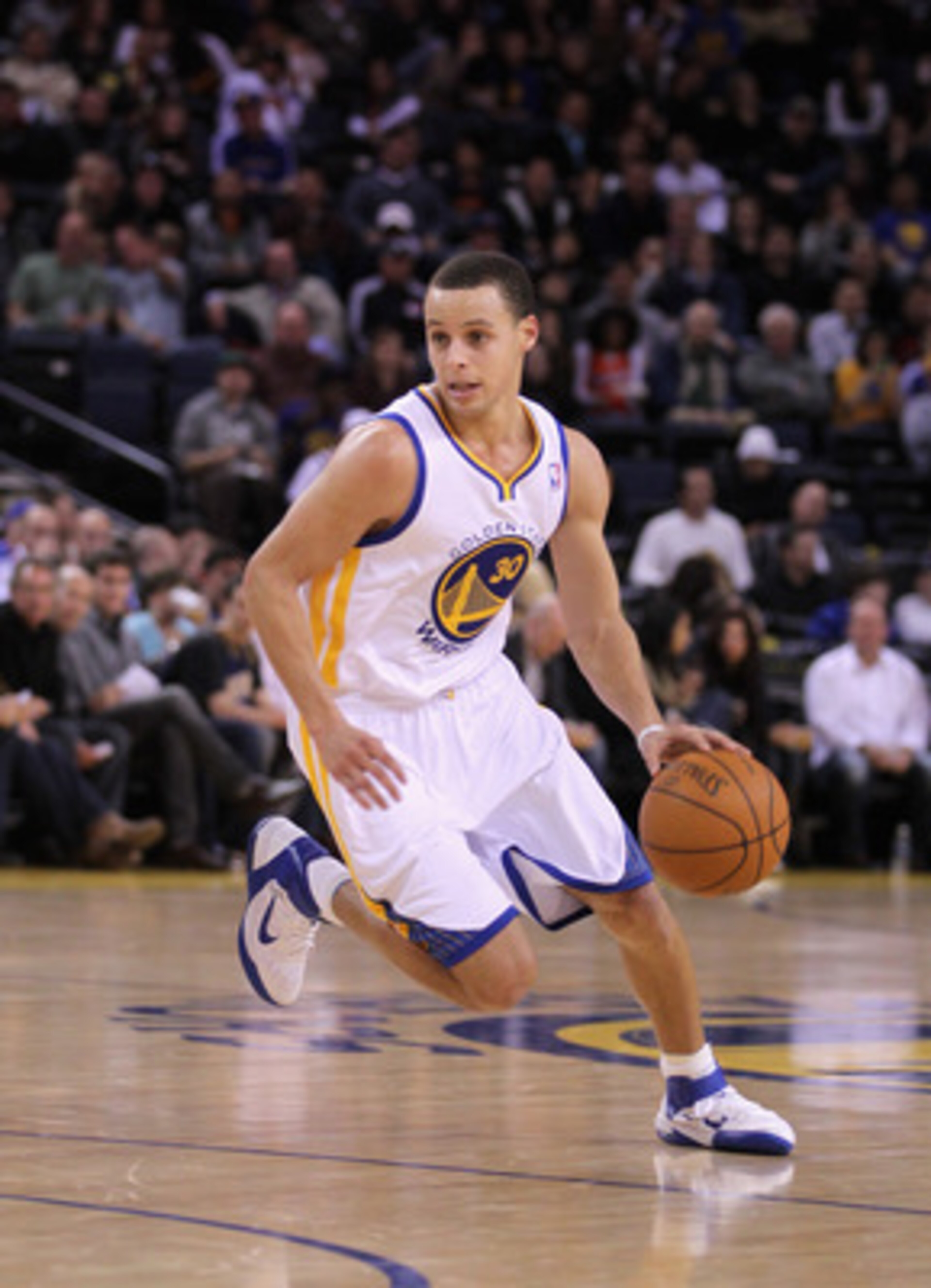 OAKLAND, CA - MARCH 25:  Stephen Curry #30 of the Golden State Warriors in action against the Toronto Raptors at Oracle Arena on March 25, 2011 in Oakland, California. NOTE TO USER: User expressly acknowledges and agrees that, by downloading and or using