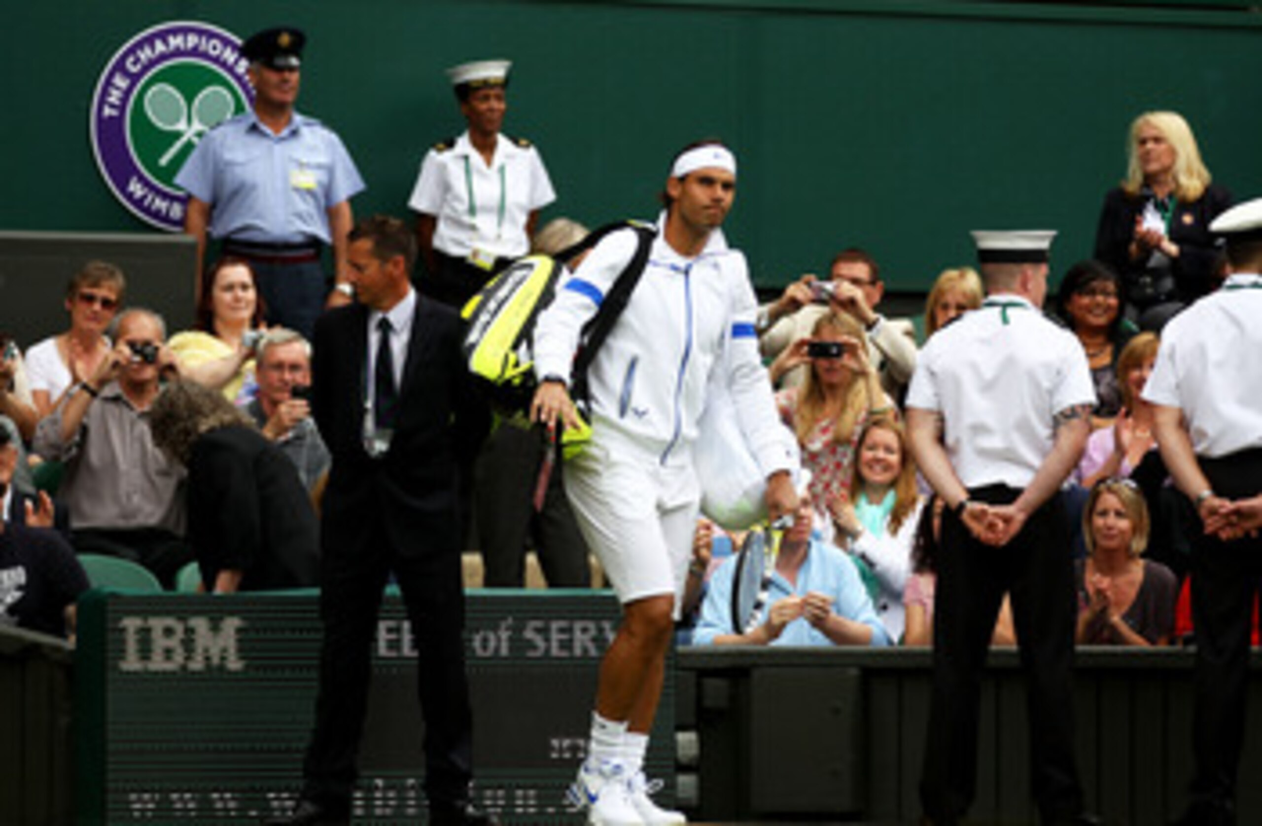 LONDON, ENGLAND - JUNE 20:  Rafael Nadal of Spain walks onto centre court before his first round match against Michael Russell of the United States on Day One of the Wimbledon Lawn Tennis Championships at the All England Lawn Tennis and Croquet Club on Ju