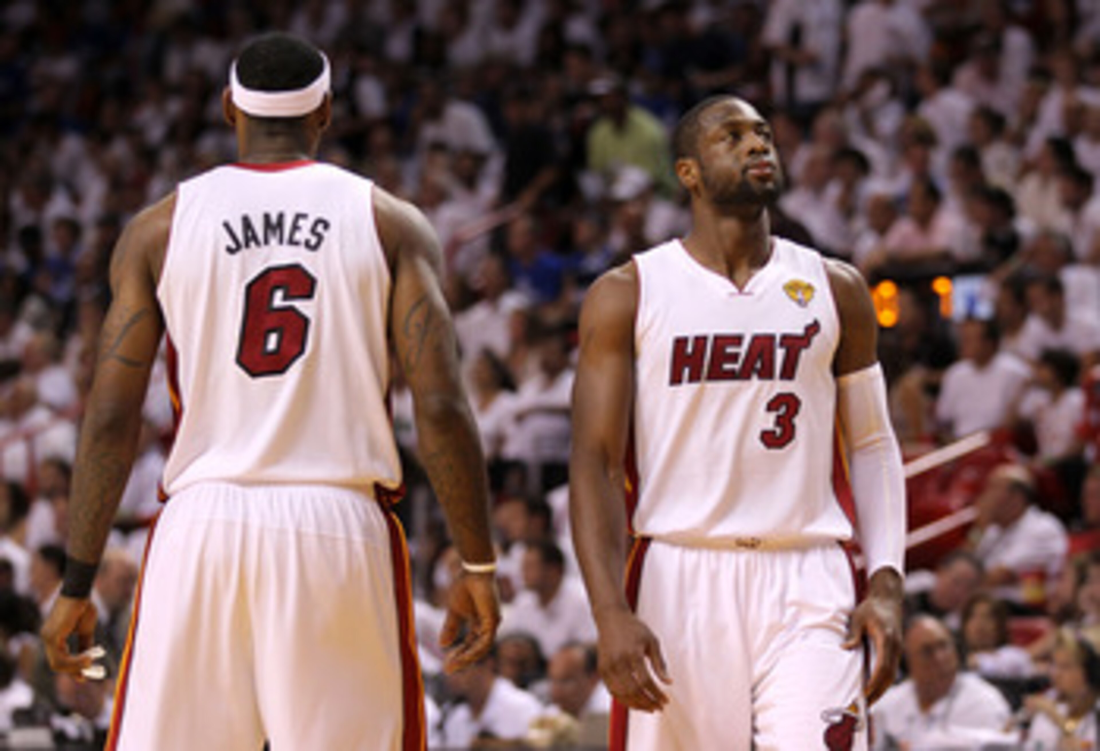 MIAMI, FL - JUNE 12:  Dwyane Wade #3 (R) and LeBron James #6 of the Miami Heat stand on court against the Dallas Mavericks in Game Six of the 2011 NBA Finals at American Airlines Arena on June 12, 2011 in Miami, Florida. NOTE TO USER: User expressly ackno