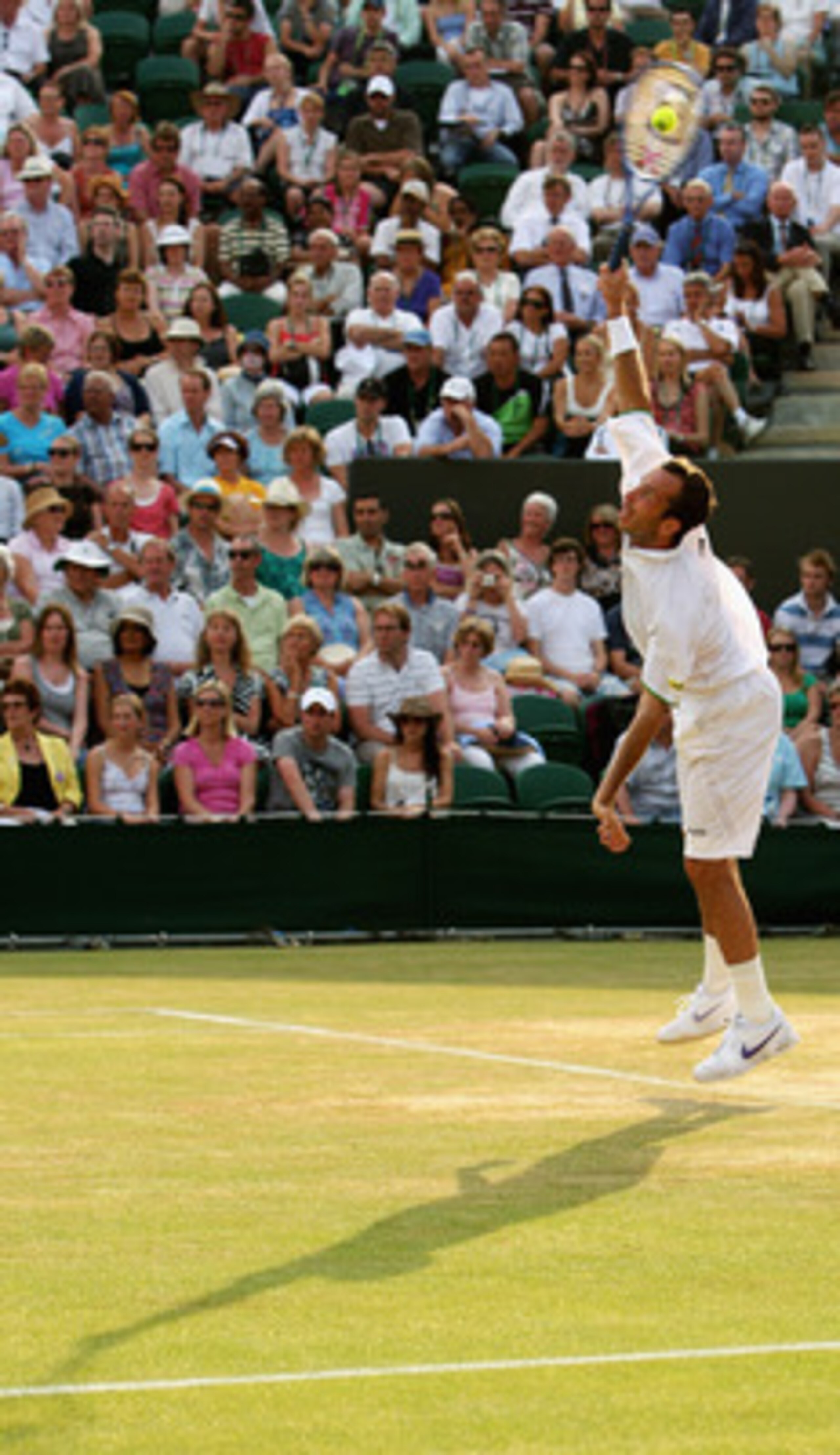 WIMBLEDON, ENGLAND - JUNE 29:  Radek Stepanek of Czech Republic serves during the men's singles fourth round match against Lleyton Hewitt of Australia on Day Seven of the Wimbledon Lawn Tennis Championships at the All England Lawn Tennis and Croquet Club 