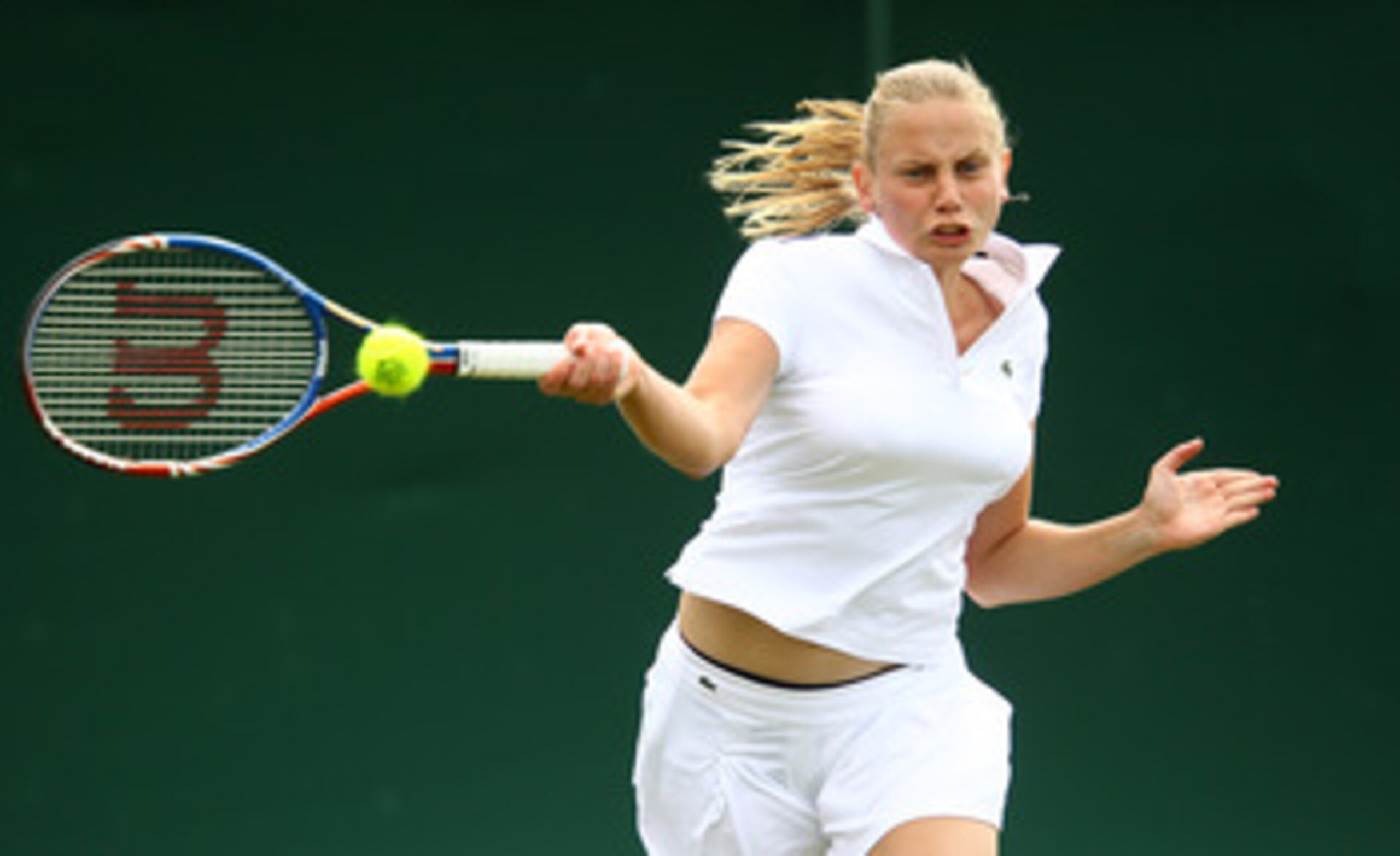 LONDON, ENGLAND - JUNE 15:  Jelena Dokic of Australia plays a forehand in her match against Melanie Klaffner of Austria during qualifying for Wimbledon 2010 Tennis at Roehampton on June 15, 2010 in London, England.  (Photo by Julian Finney/Getty Images)