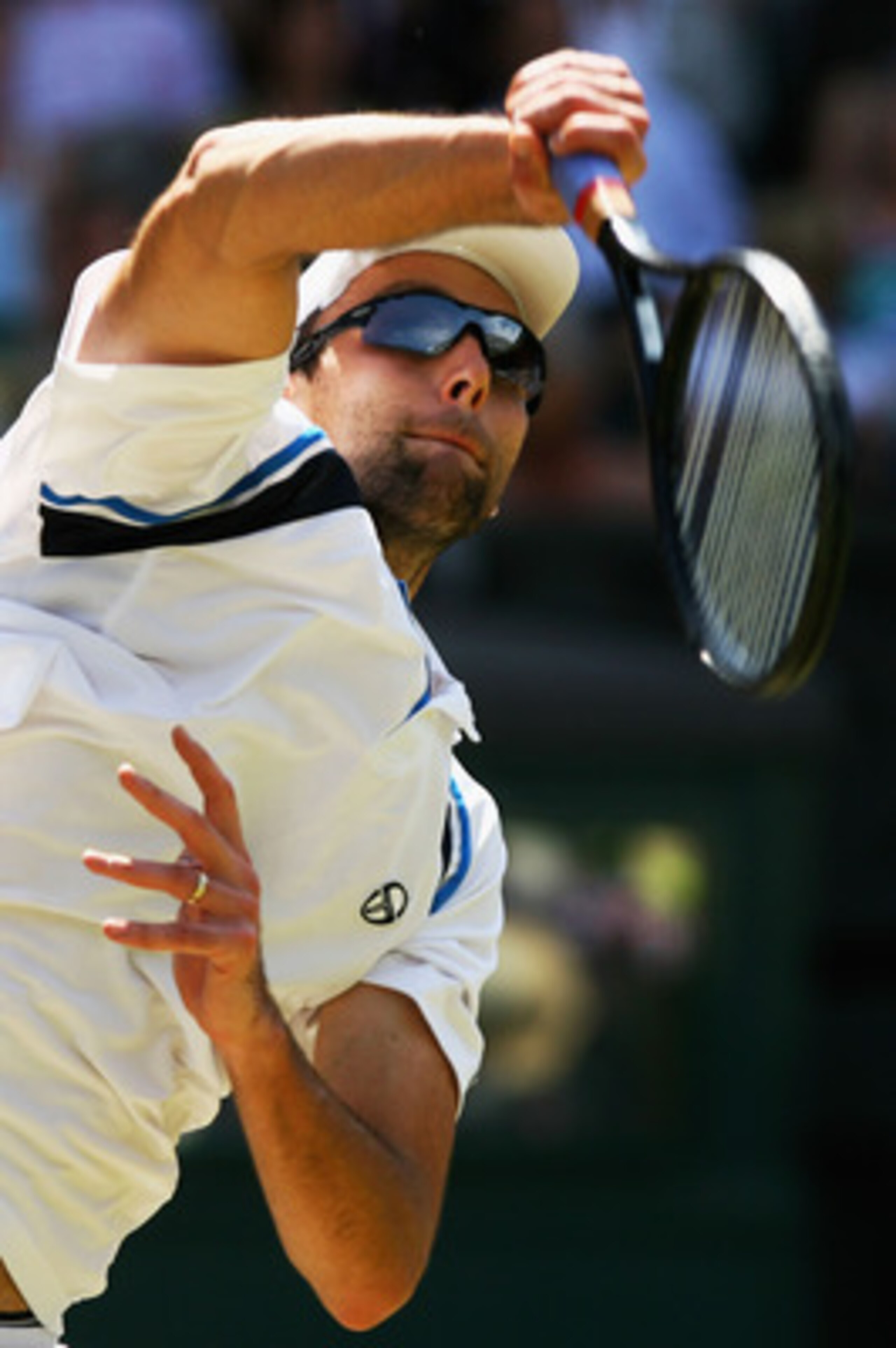 WIMBLEDON, ENGLAND - JULY 01:  Ivo Karlovic of Croatia serves during the men's singles quarter final match against Roger Federer of Switzerland on Day Nine of the Wimbledon Lawn Tennis Championships at the All England Lawn Tennis and Croquet Club on July 