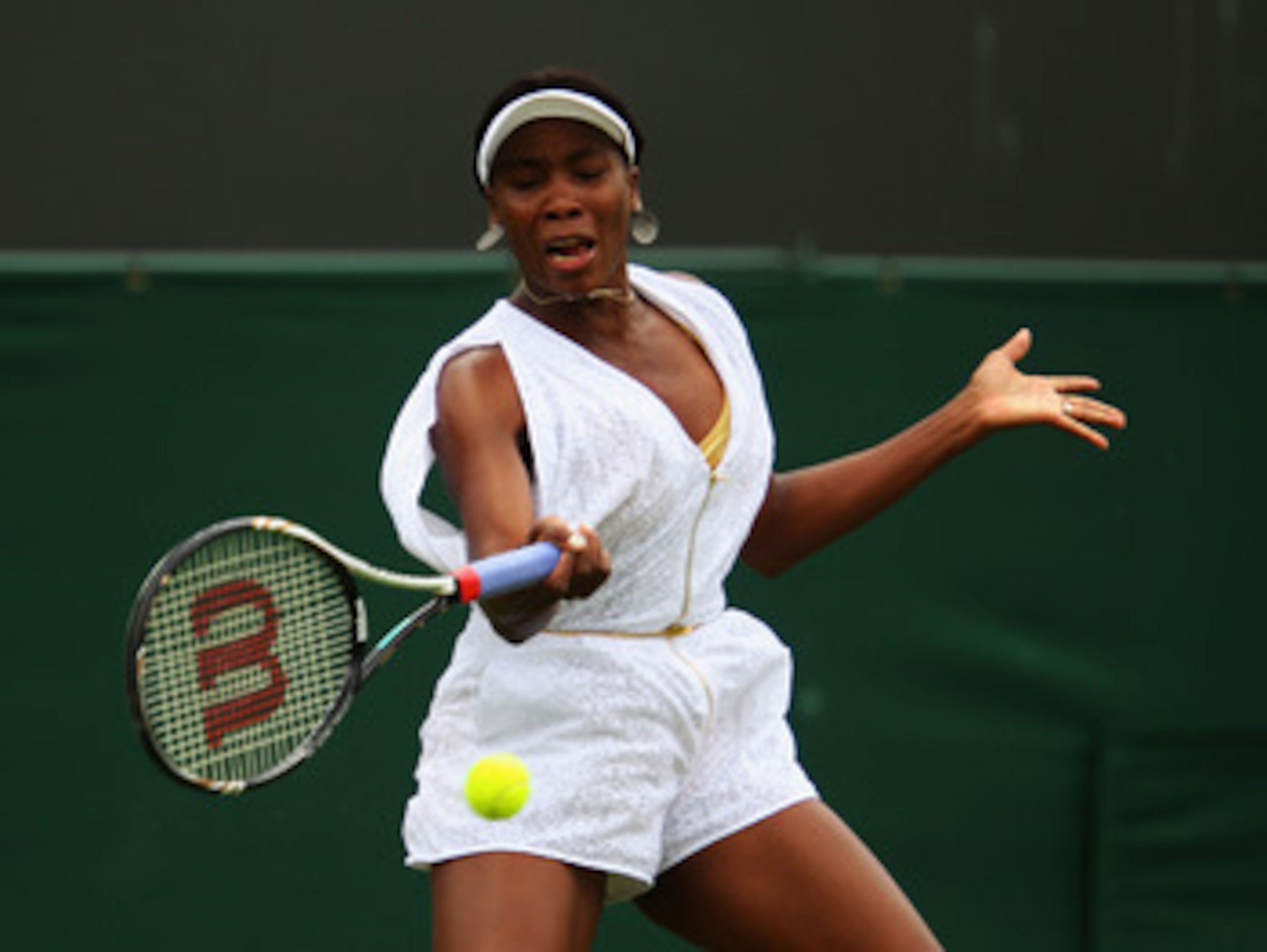 LONDON, ENGLAND - JUNE 20:  Venus Williams of the United States returns a shot during her first round match Akgul Amanmuradova of Uzbekistan on Day One of the Wimbledon Lawn Tennis Championships at the All England Lawn Tennis and Croquet Club on June 20, 