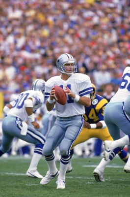 ANAHEIM, CA - JANUARY 4:  Quarterback Danny White #11 of the Dallas Cowboys looks to pass during a 1985 NFC Divisional Playoff game against the Los Angeles Rams at Anaheim Stadium on January 4, 1996 in Anaheim, California.  The Rams won 20-0.  (Photo by G