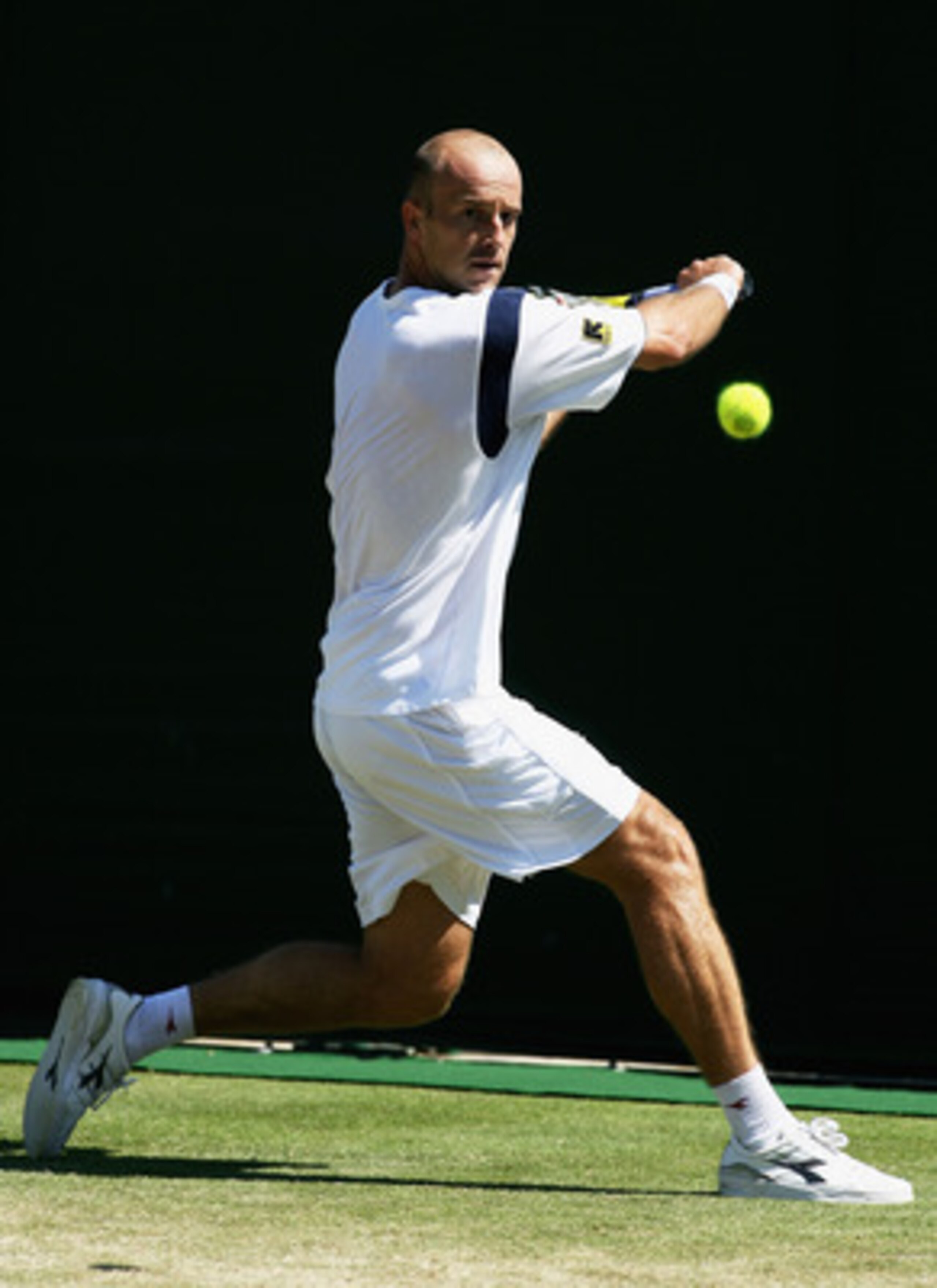 LONDON - JUNE 29:  Ivan Ljubicic of Croatia plays a backhand during the Men's Singles third round match against Paul-Henri Mathieu of France during day five of the Wimbledon Lawn Tennis Championships at the All England Lawn Tennis and Croquet Club on June