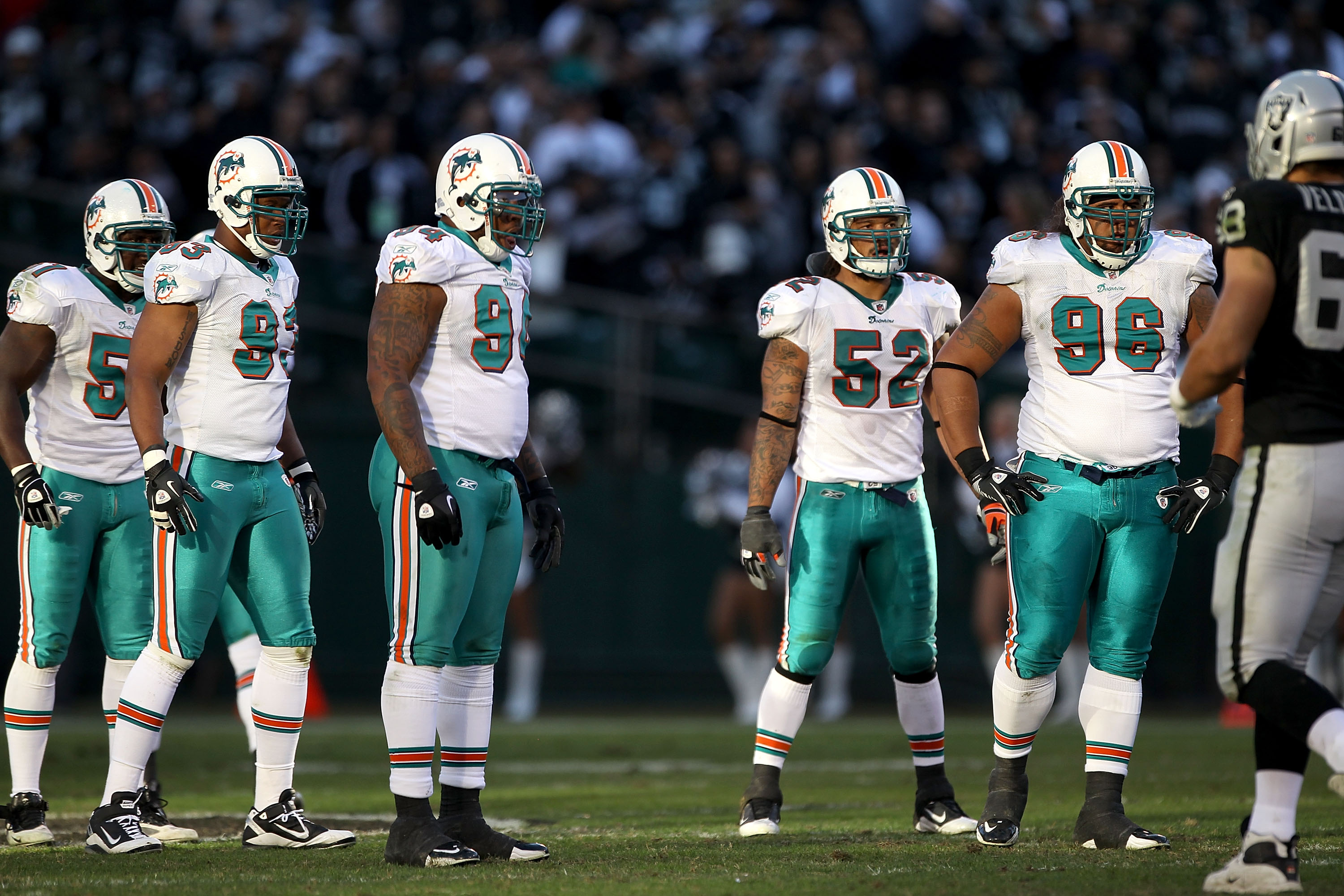 OAKLAND, CA - NOVEMBER 28: Tim Dobbins #51, Quentin Moses #93, Randy Starks #94, Channing Crowder #52 and Paul Soliai #96 of the Miami Dolphins get ready for a play against the Oakland Raiders at Oakland-Alameda County Coliseum on November 28, 2010 in Oa OAKLAND, CA - NOVEMBER 28: Tim Dobbins #51, Quentin Moses #93, Randy Starks #94, Channing Crowder #52 and Paul Soliai #96 of the Miami Dolphins get ready for a play against the Oakland Raiders at Oakland-Alameda County Coliseum on November 28, 2010 in Oa