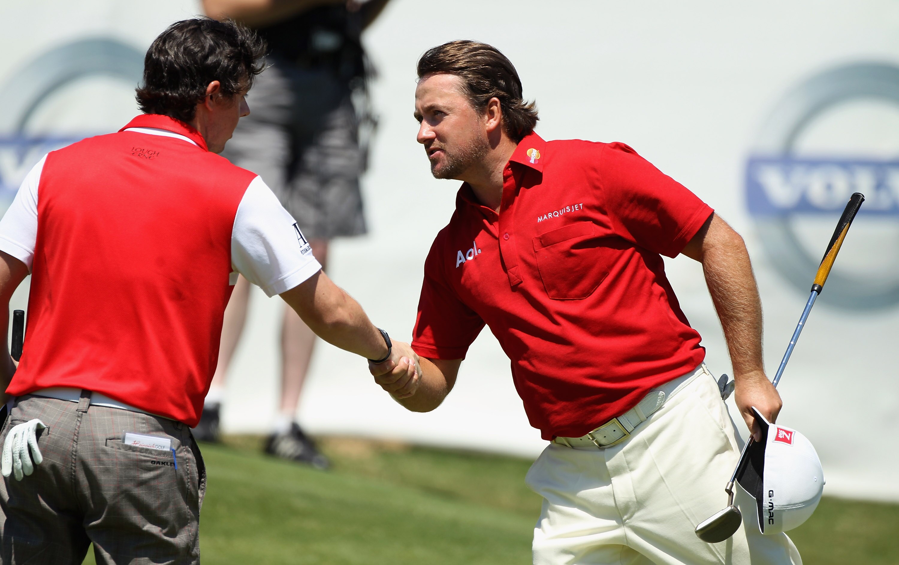 CASARES, SPAIN - MAY 21:  Victor Graeme McDowell of Northern Ireland is congratulated by countryman Rory McIlroy after winning his last 16 match of the Volvo World Match Play Championships at Finca Cortesin on May 20, 2011 in Casares, Spain.  (Photo by Wa