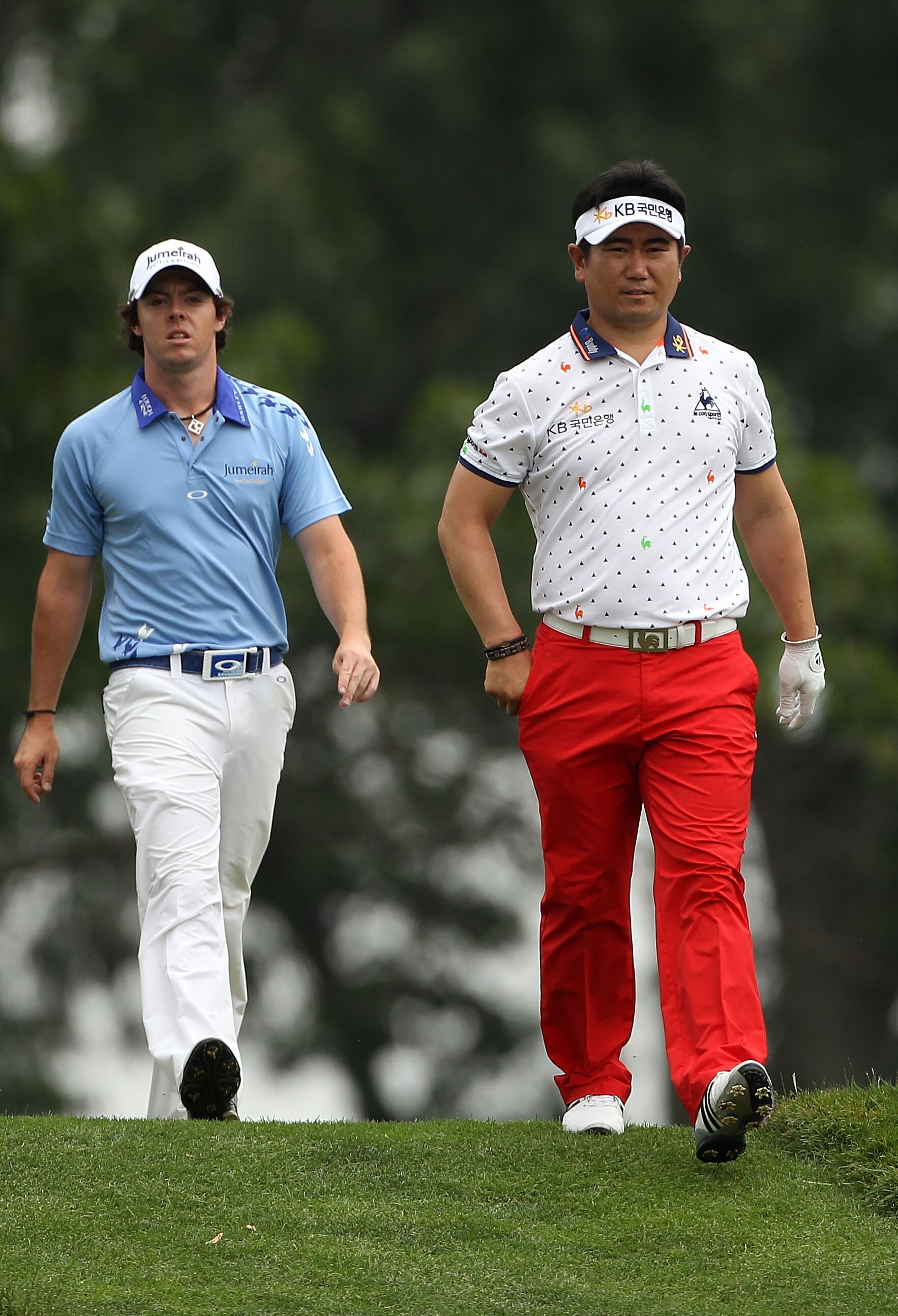 BETHESDA, MD - JUNE 19:  Y.E. Yang of South Korea (R) and  Rory McIlroy of Northern Ireland (L) walk off the fifth tee during the final round of the 111th U.S. Open at Congressional Country Club on June 19, 2011 in Bethesda, Maryland.  (Photo by Andrew Re