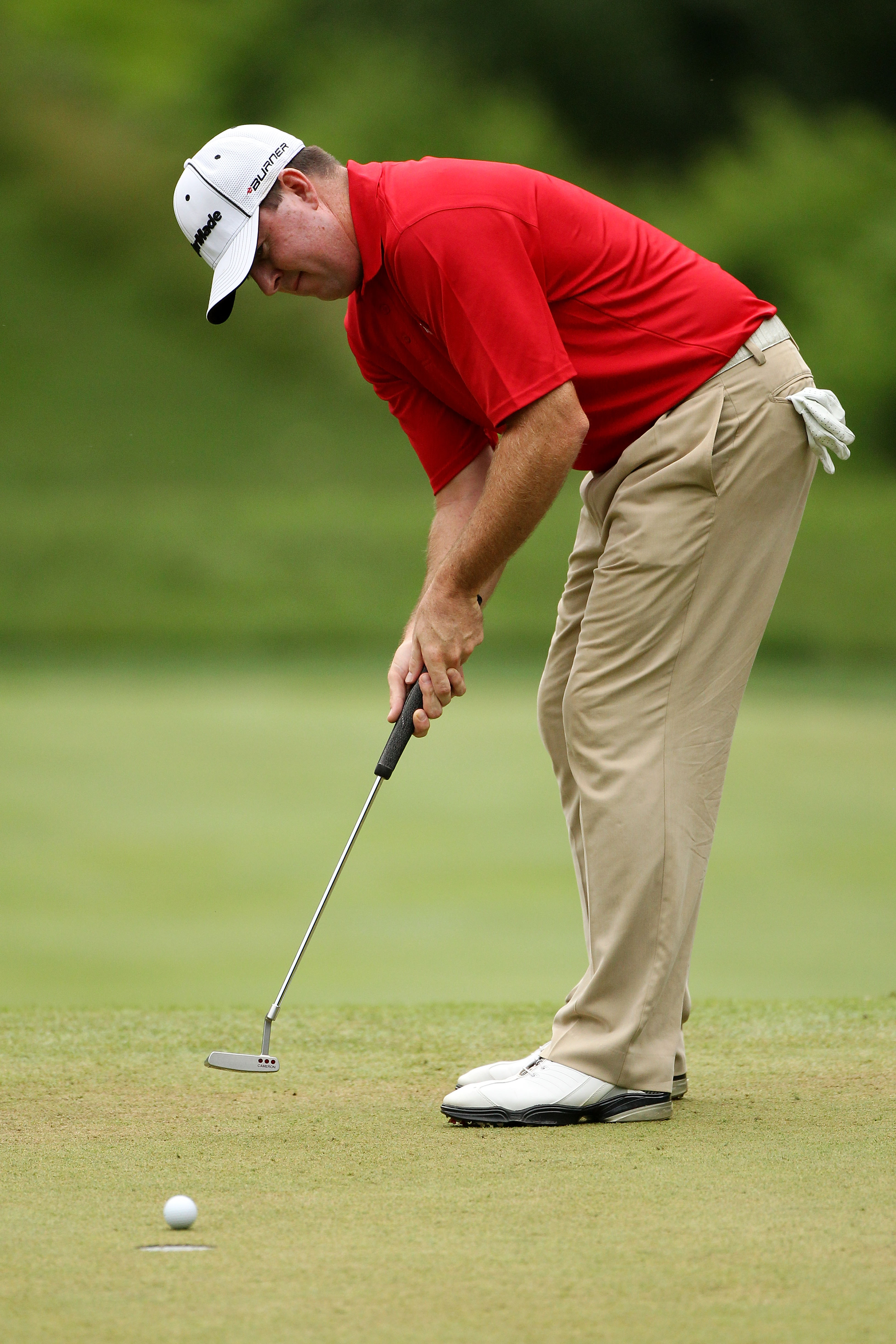 BETHESDA, MD - JUNE 18:  Robert Garrigus hits a putt on the 13th green during the third round of the 111th U.S. Open at Congressional Country Club on June 18, 2011 in Bethesda, Maryland.  (Photo by Andrew Redington/Getty Images)