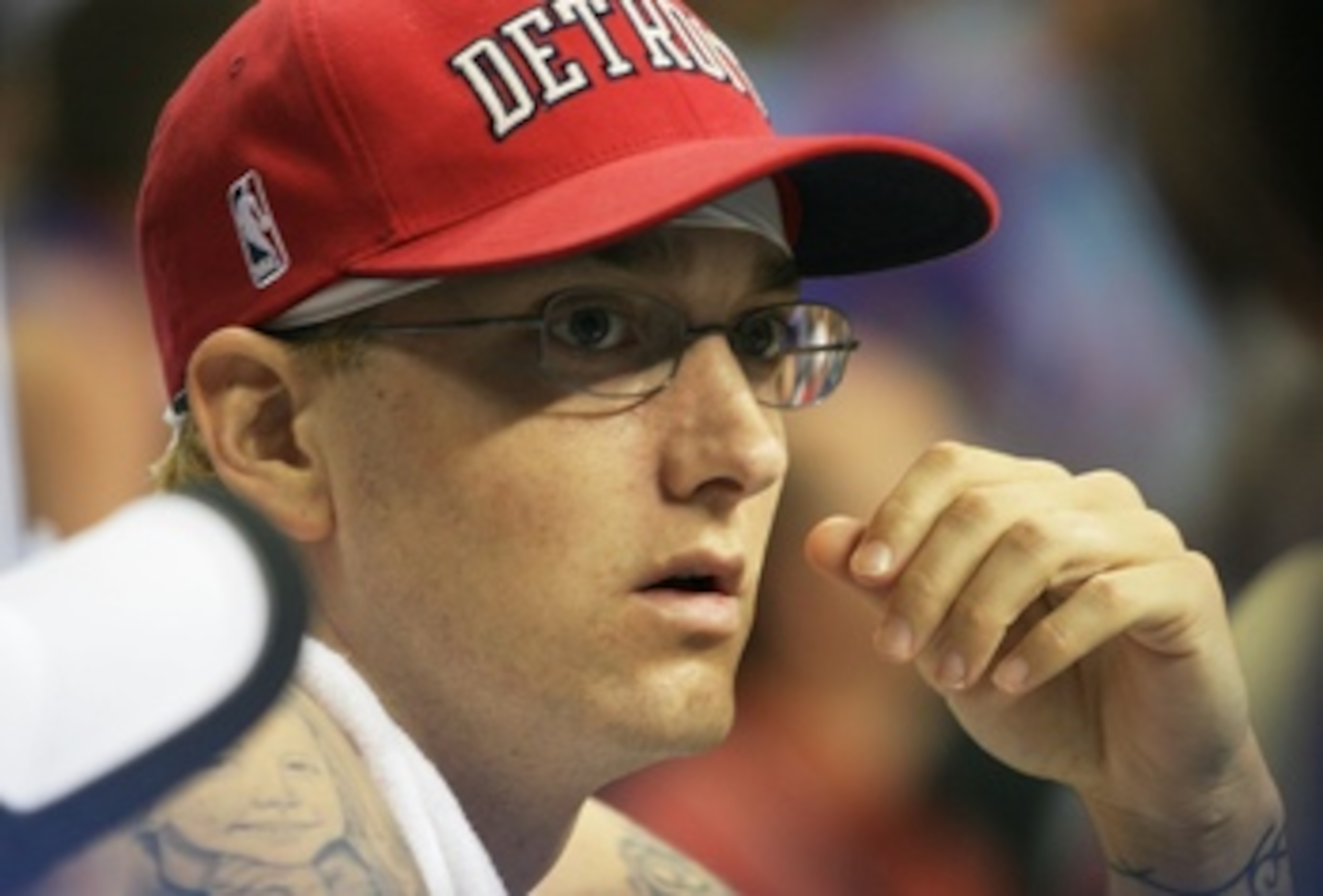 AUBURN HILLS, MI - JUNE 14: Hip hop artist Eminem watches as the San Antonio Spurs take on the Detroit Pistons in Game three of the 2005 NBA Finals at The Palace of Auburn Hills on June 14, 2005 in Auburn Hills, Michigan. NOTE TO USER: User expressly ac AUBURN HILLS, MI - JUNE 14: Hip hop artist Eminem watches as the San Antonio Spurs take on the Detroit Pistons in Game three of the 2005 NBA Finals at The Palace of Auburn Hills on June 14, 2005 in Auburn Hills, Michigan. NOTE TO USER: User expressly ac