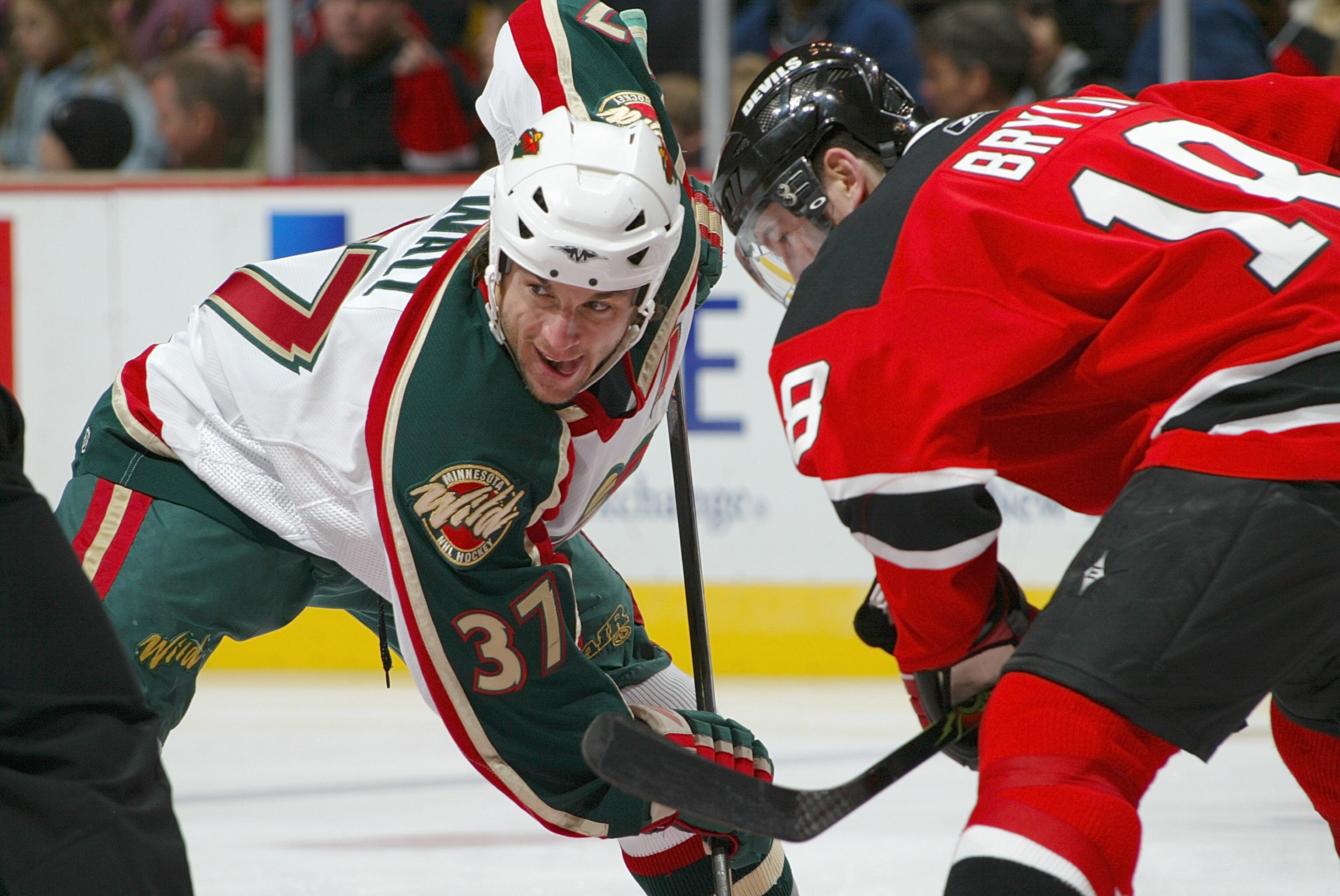 EAST RUTHERFORD, NJ - DECEMBER 3: Wes Walz #37 of the Minnesota Wild faces off against Jason Ryznar #19 of the New Jersey Devils at the Continental Airlines Arena on December 3, 2005 in East Rutherford, New Jersey. (Photo by Mike Stobe/Getty Images)