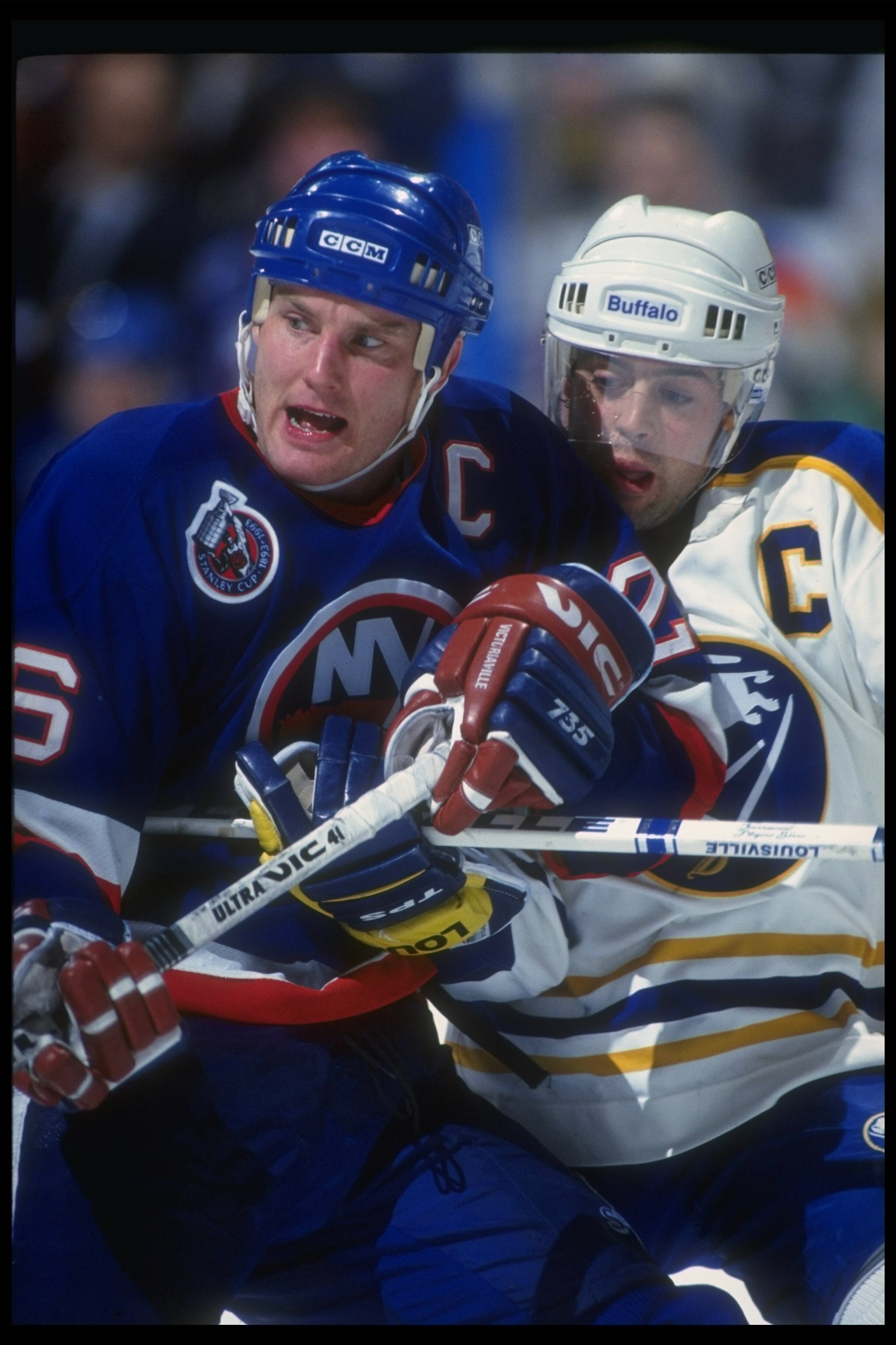 BUFFALO, NY - DECEMBER 4: Dec 1992: Rightwinger Patrick Flatley #15 of the New York Islanders works against Pat LaFontaine #16 of the Buffalo Sabres during their game on December 4, 1992 at the Memorial Auditorium in Buffalo, New York.  (Photo by Rick Ste
