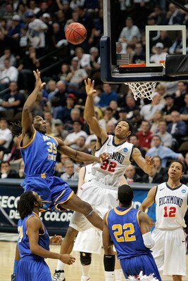 DENVER, CO - MARCH 19: Kenneth Faried #35 of the Morehead State Eagles shoots over Justin Harper #32 of the Richmond Spiders during the third round of the 2011 NCAA men's basketball tournament at Pepsi Center on March 19, 2011 in Denver, Colorado. (Phot DENVER, CO - MARCH 19: Kenneth Faried #35 of the Morehead State Eagles shoots over Justin Harper #32 of the Richmond Spiders during the third round of the 2011 NCAA men's basketball tournament at Pepsi Center on March 19, 2011 in Denver, Colorado. (Phot