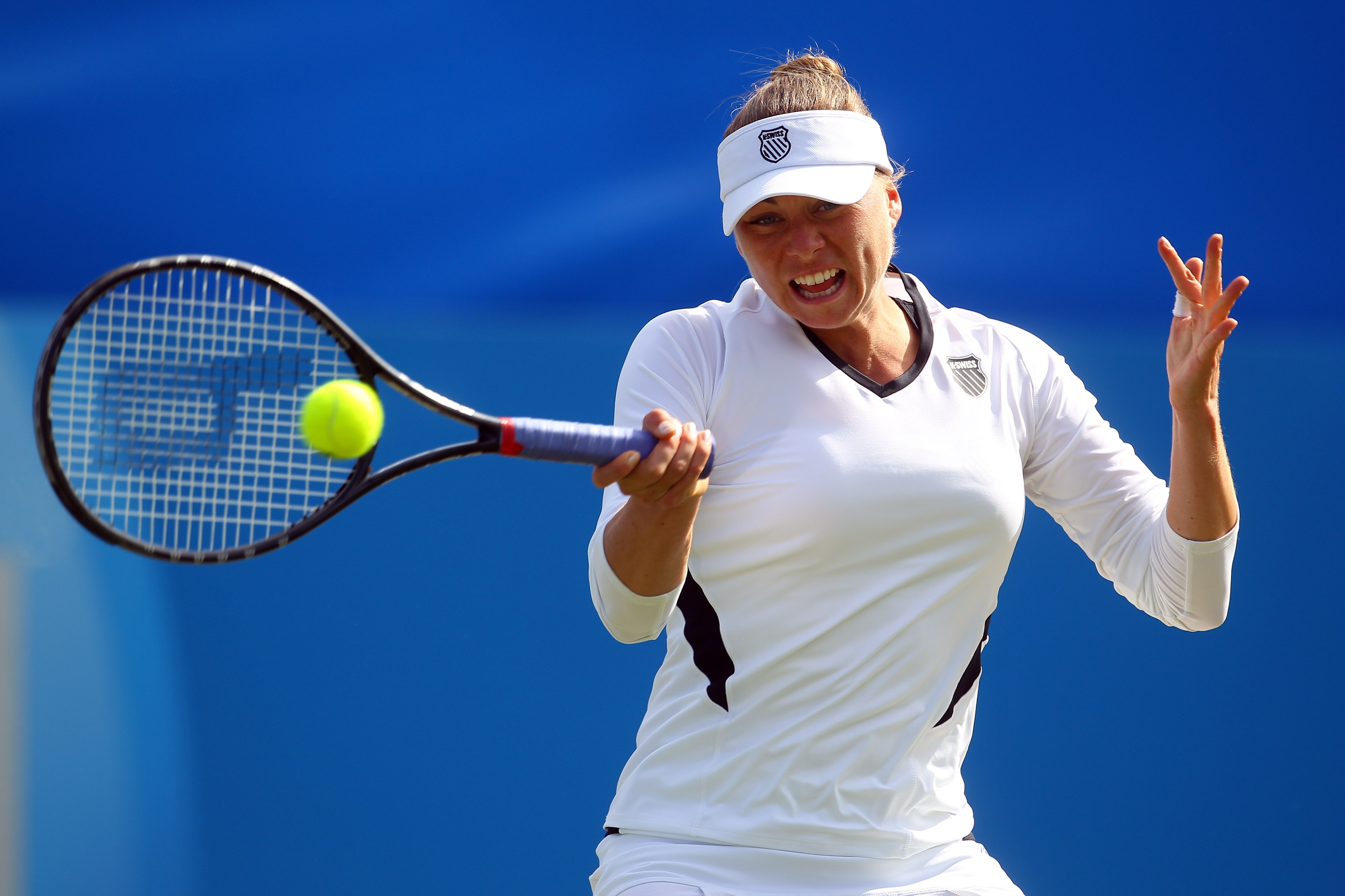 EASTBOURNE, ENGLAND - JUNE 16: Vera Zvonareva of Russia in action against Samantha Stosur of Australia during day six of the AEGON International on June 16, 2011 in Eastbourne, England.  (Photo by Clive Rose/Getty Images)